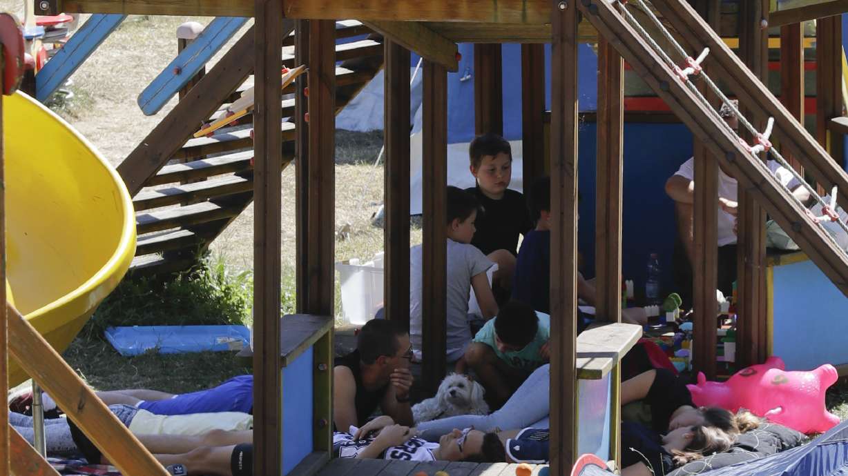 Italy honors quake victims as bishop warns of reconstruction