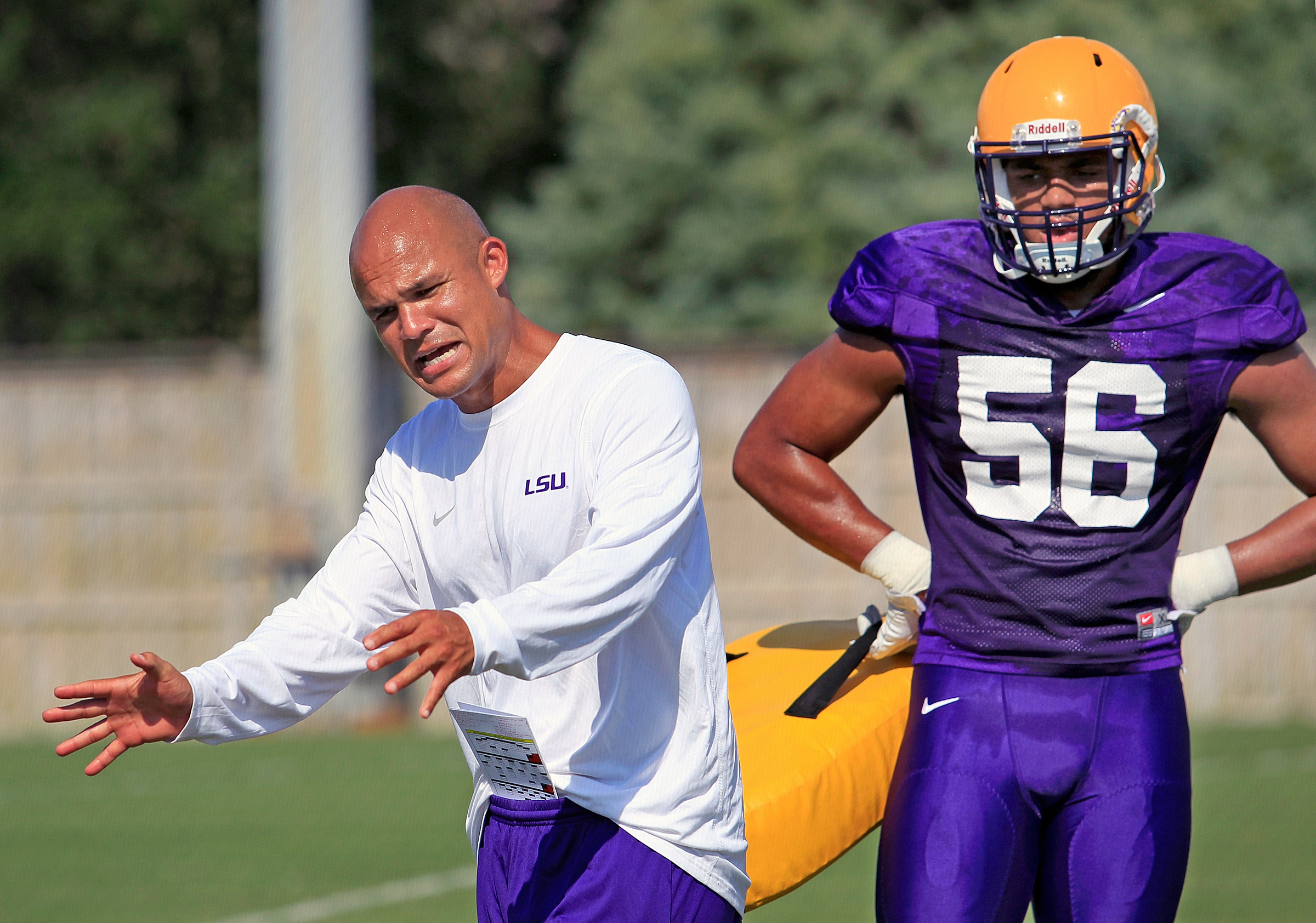 In this Aug. 6, 2016, photo, LSU defensive coordinator Dave Aranda gives instructions to Tigers M.J. Patterson during an NCAA college football practice in Baton Rouge, La. (Photo: Brett Duke/NOLA.com The Times-Picayune via AP)