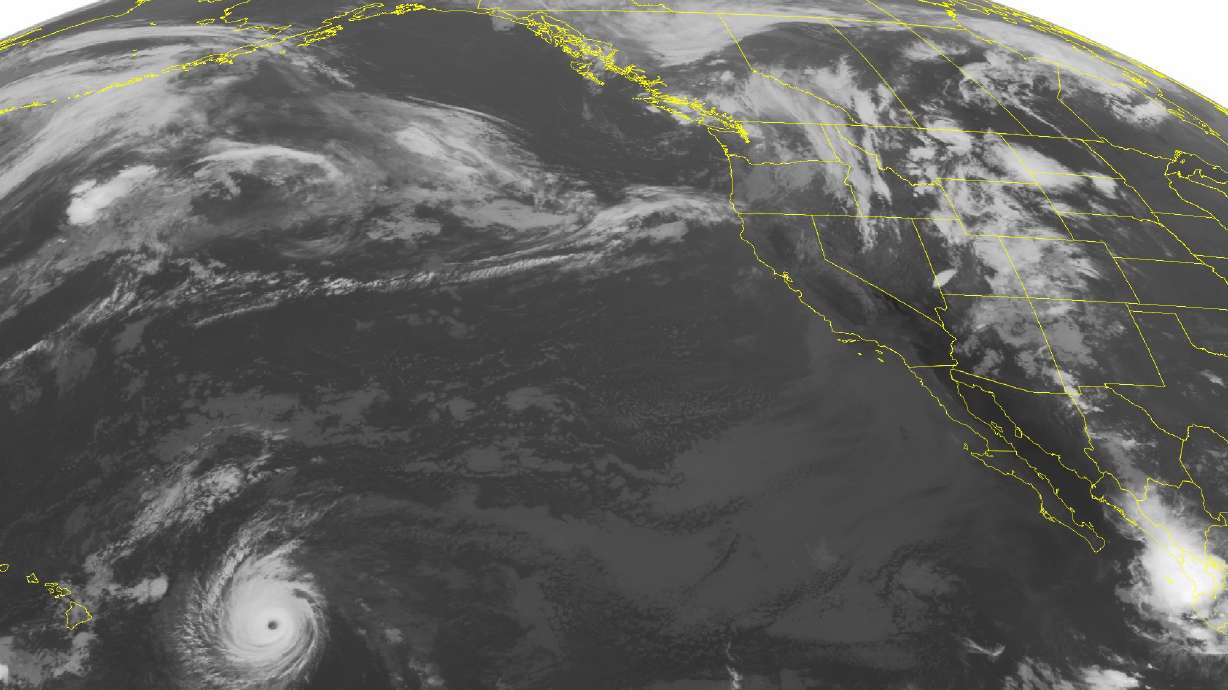 The Latest: High surf warning for east-facing Hawaii shores