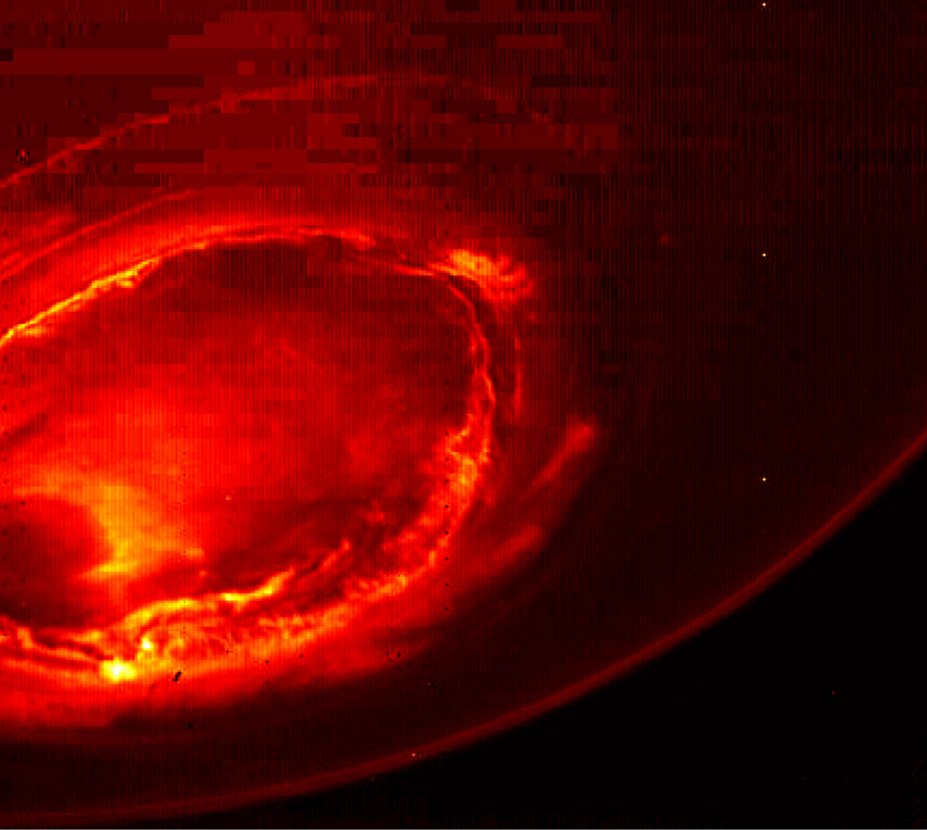 This Aug. 27, 2016 infrared image provided by NASA shows the southern aurora of Jupiter, captured by NASA's Juno spacecraft. The phenomenon can hardly be seen from Earth due to the position of the two planets. The image is a mosaic of three photographs made as the spacecraft was moving away from the gas giant. (NASA/JPL-Caltech/SwRI/MSSS via AP)