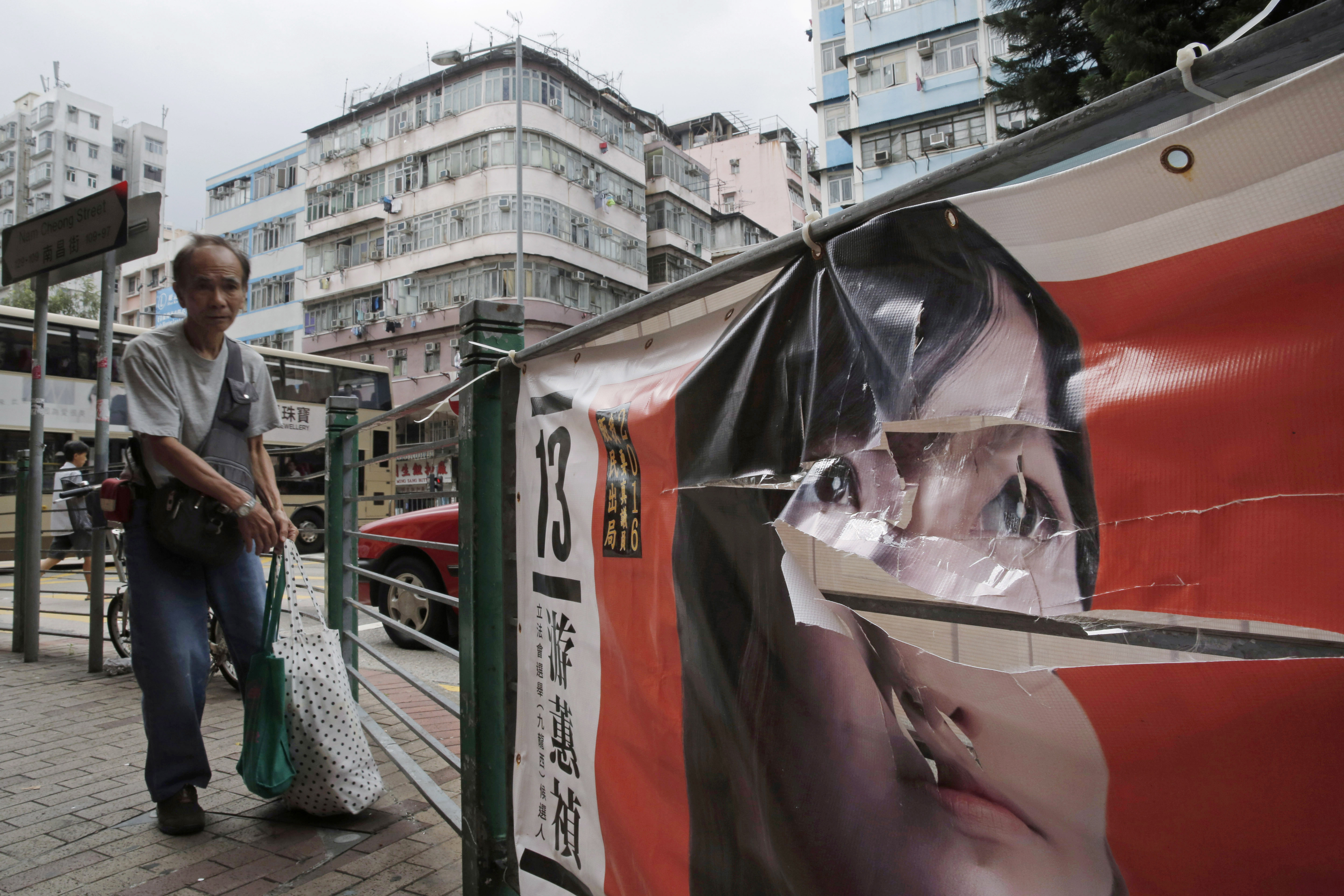 AP PHOTOS: Vandalized posters ahead of Hong Kong's elections