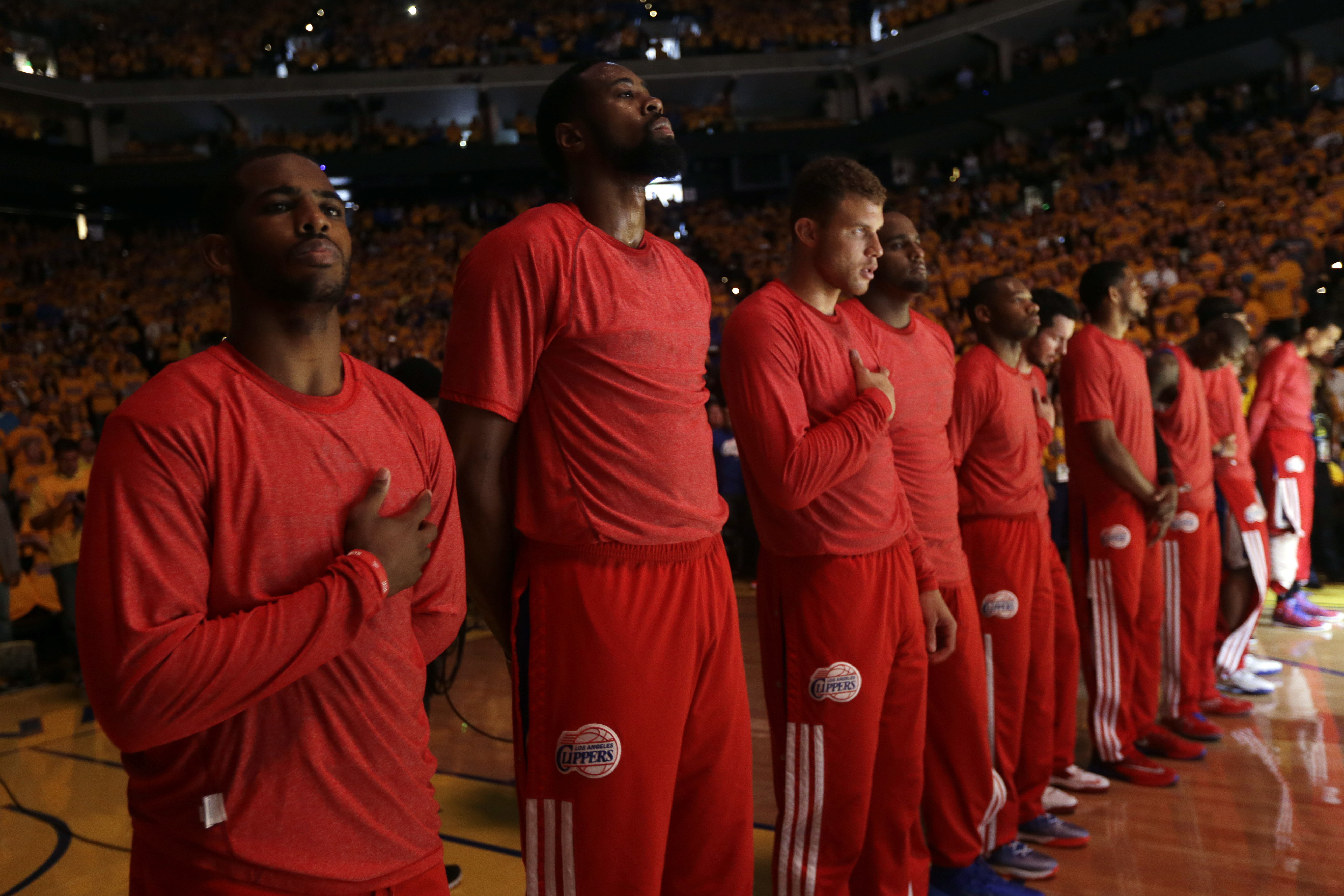 FILE - Members of the Clippers chose not to speak publicly about owner Donald Sterling. Instead, they made a silent protest. The players wore their red Clippers' warmup shirts inside out to hide the team's logo. (Marcio Jose Sanchez, AP Photo, File)