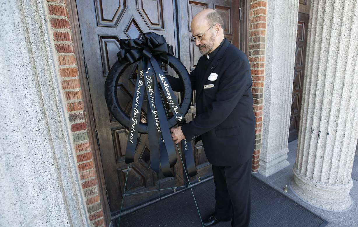 The Rev. Father Elias Koucos places a wreath mourning the loss of the Rev. Father Matthew Gilbert at the Greek Orthodox Holy Trinity Cathedral in Salt Lake City on Friday, Sept. 9, 2016. The Rev. Gilbert, a longtime priest at the cathedral, died Wednesday in Phoenix, where he was undergoing treatment for cancer. (Photo: Jeffrey D. Allred, Deseret News)