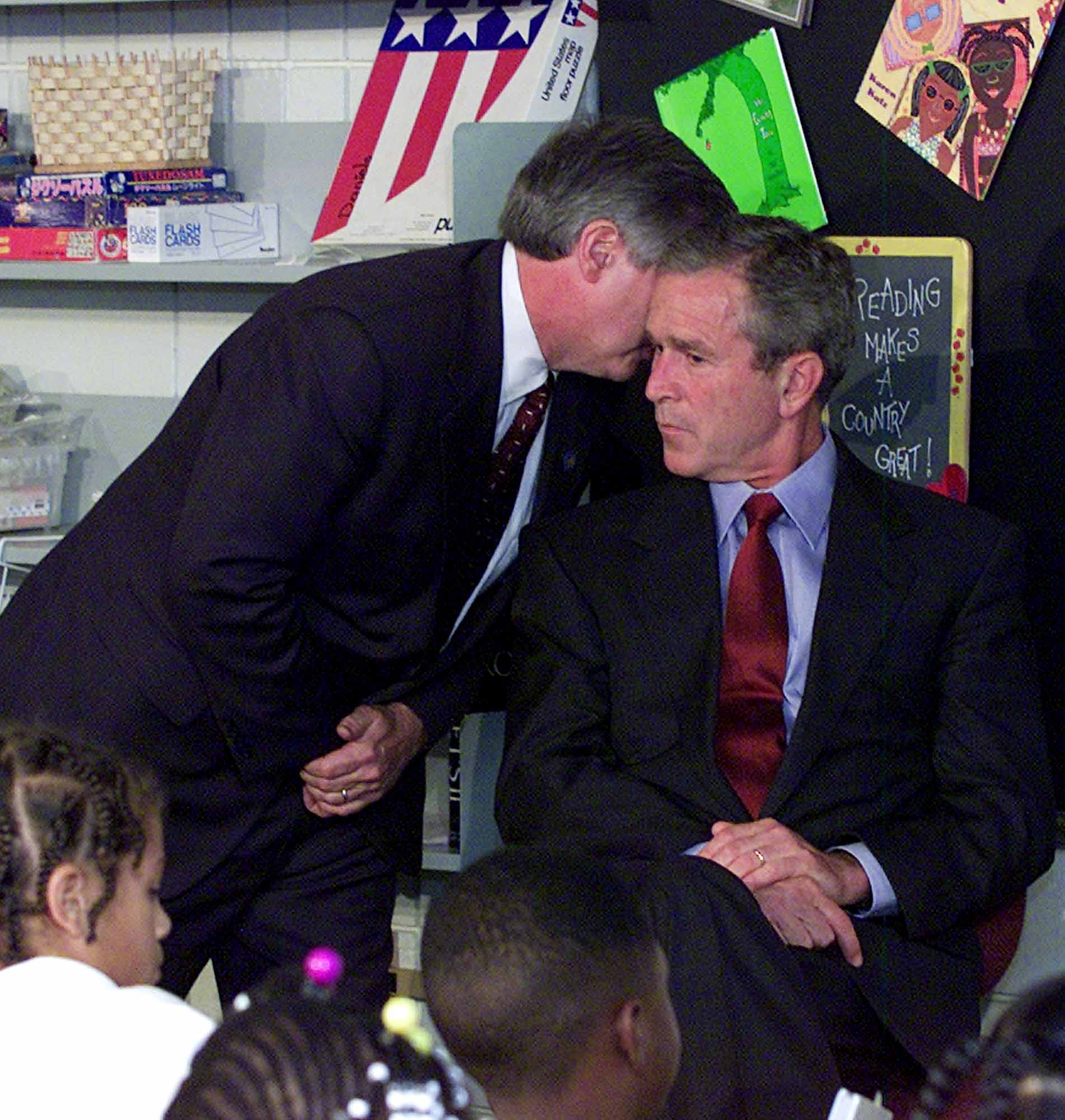 President Bush's Chief of Staff Andy Card whispers into the ear of the President to give him word of the plane crashes into the World Trade Center, during a visit to the Emma E. Booker Elementary School in Sarasota, Fla., Tuesday, Sept. 11, 2001. (Doug Mills, AP Photo)