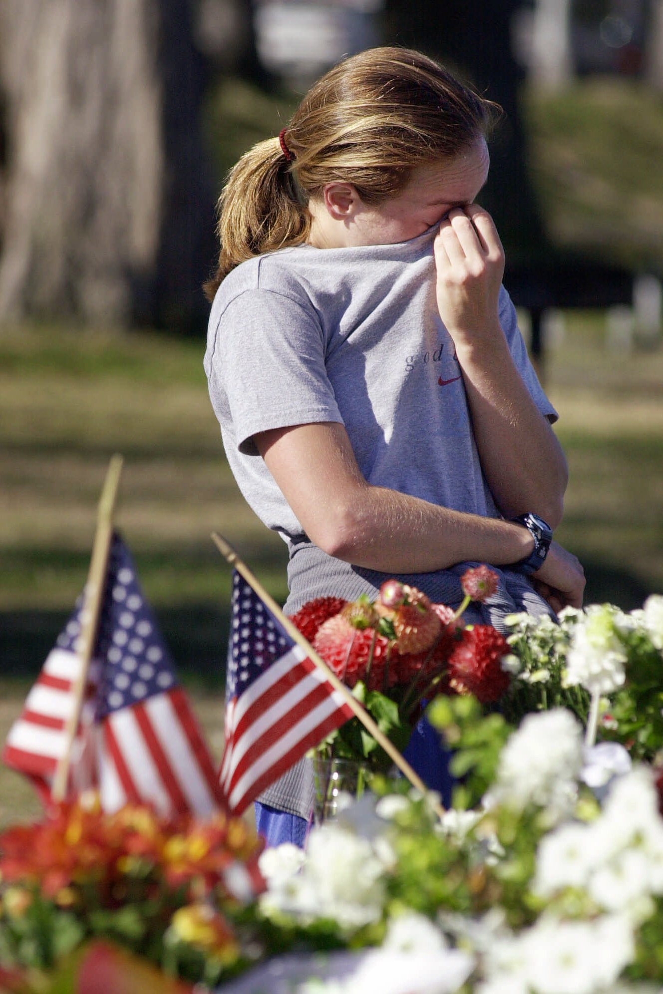 Laura Starita of New York, wipes tears from her eyes Wednesday morning, Sept. 12, 2001, in Seattle, at a make-shift memorial for victims of the terrorist attacks a day earlier. (Elaine Thompson, AP Photo)