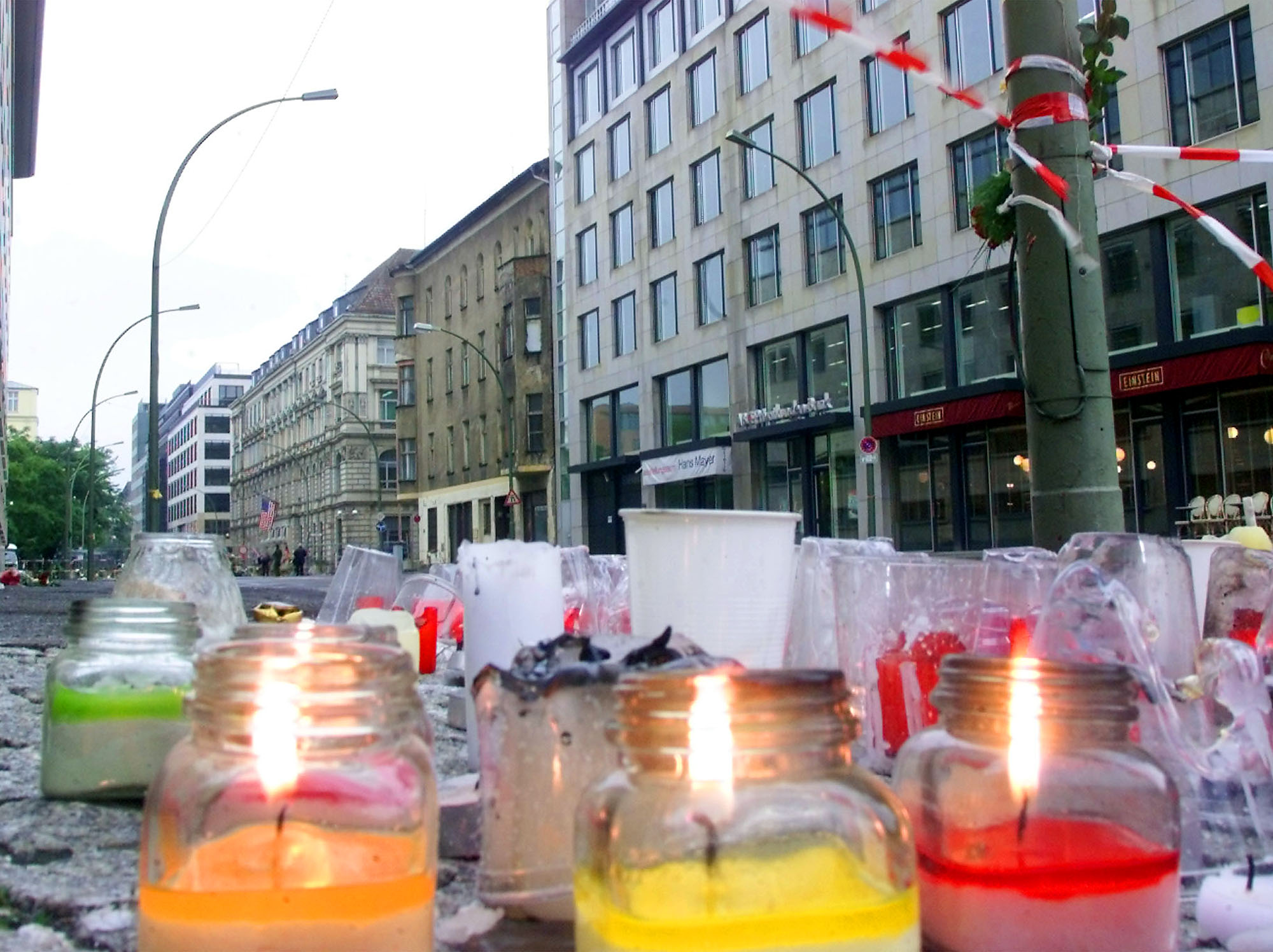 Candles burn near the U.S. embassy, center left, in Berlin, Wednesday, Sept. 12, 2001. Berliners showed their solidarity following the Sept. 11 terrorist attacks are no longer allowed to approach the embassy in Berlin's government district. (Jockel Finck, AP Photo)