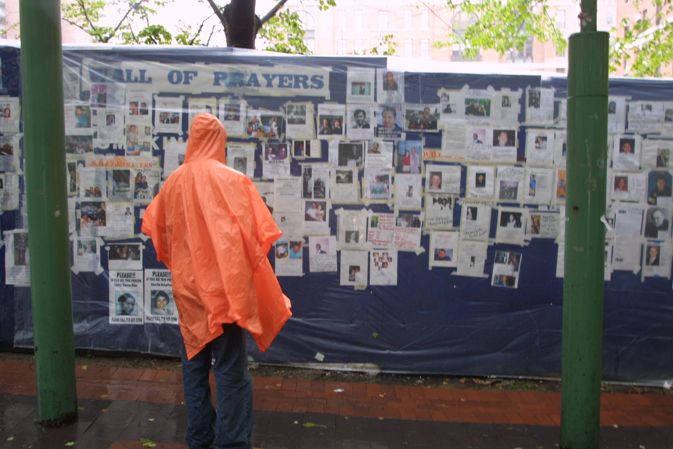 A woman looks at missing person posters of victims of the September 11 terrorist attacks on the World Trade Center in New York City on Sept. 14, 2001.(Robert Spencer, AP Photo)