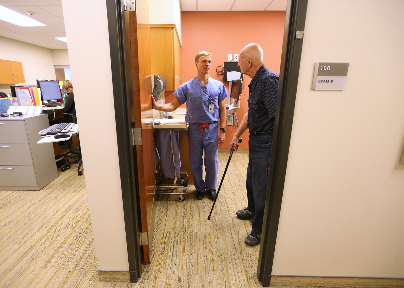 Dr. Mark Mahan talks with patient Bruce DeSpain on Friday, Sept. 9, 2016, at the South Jordan Health Center. Mahan, who was an investment banker in New York City on 9/11, decided to change careers after the terrorist attack and became a neurosurgeon. (Photo: Scott G Winterton, Deseret News)