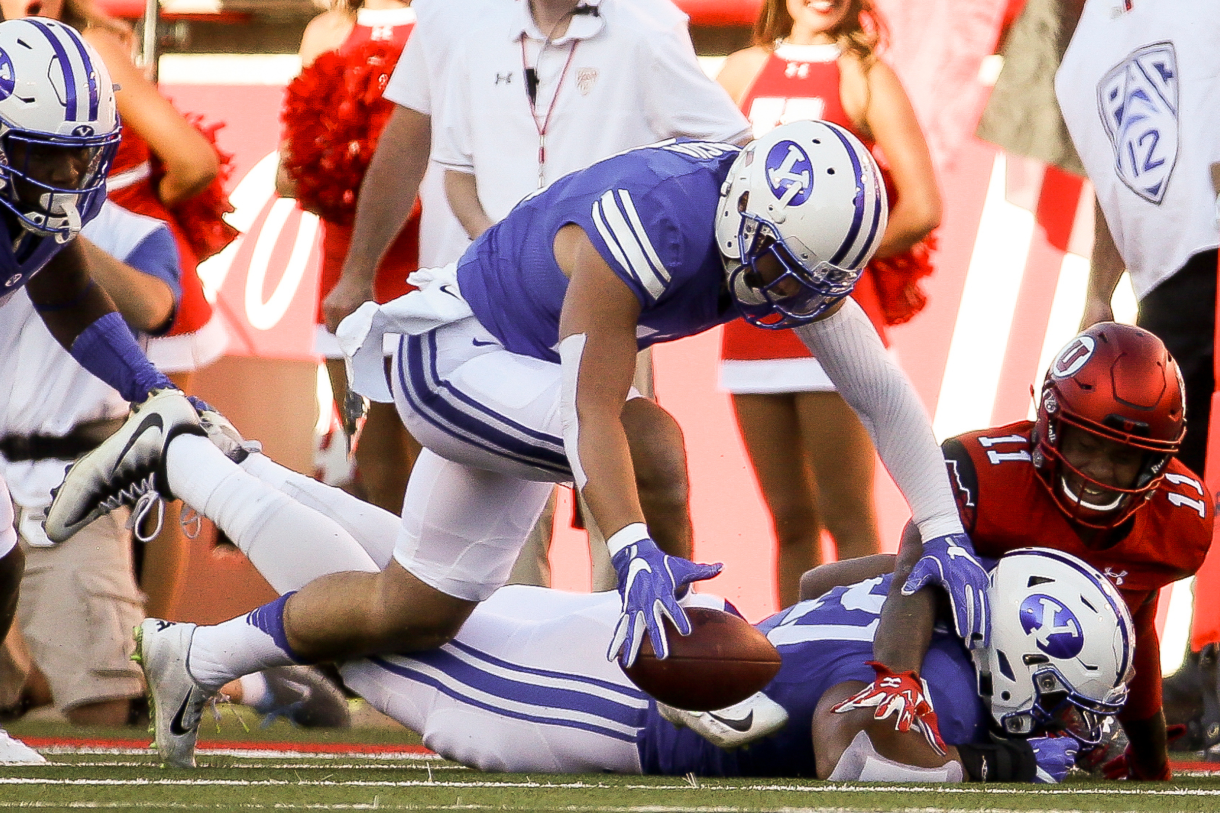 Brigham Young Cougars defensive back Kai Nacua (12) makes a fumble recovery during a game against Utah at Rice-Eccles Stadium in Salt Lake City on Saturday, Sept. 10, 2016. (Photo: Spenser Heaps, Deseret News)