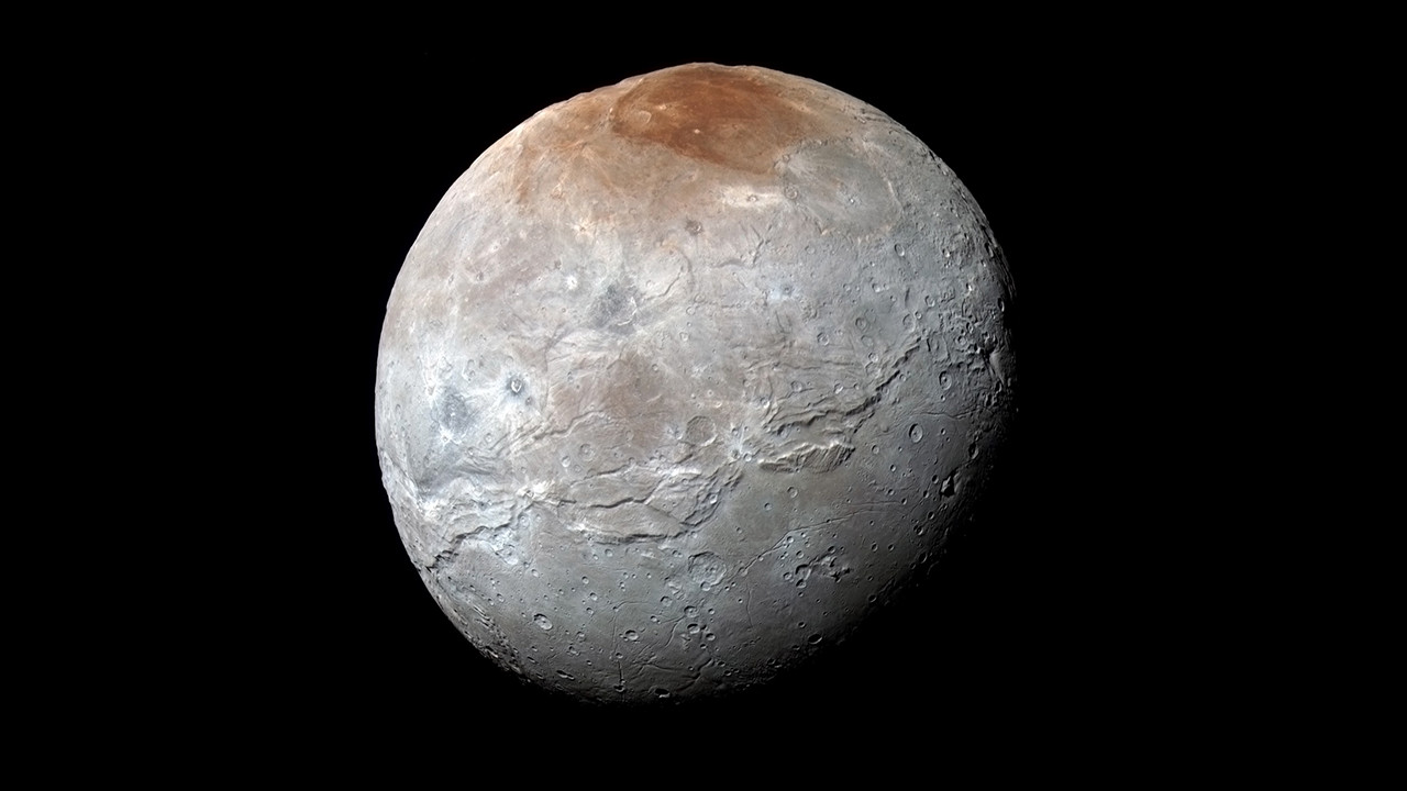 Study: Pluto 'spray-painting' poles of its big moon Charon