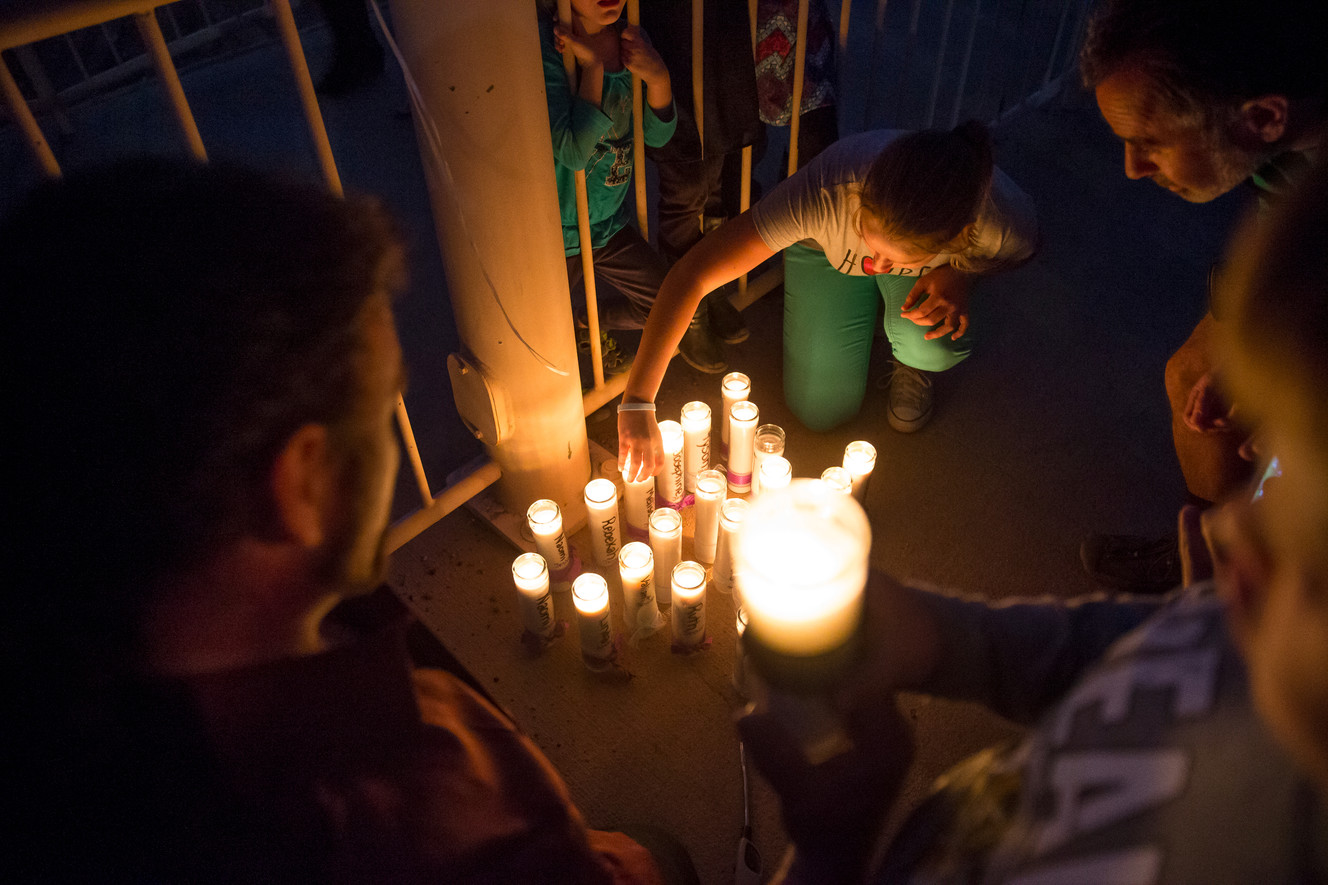 People carry candles representing each of the victims killed in last year's floods during a memorial ceremony at Cottonwood Park in Colorado City, Arizona, on Wednesday, Sept. 14, 2016. (Photo: Spenser Heaps, Deseret News)