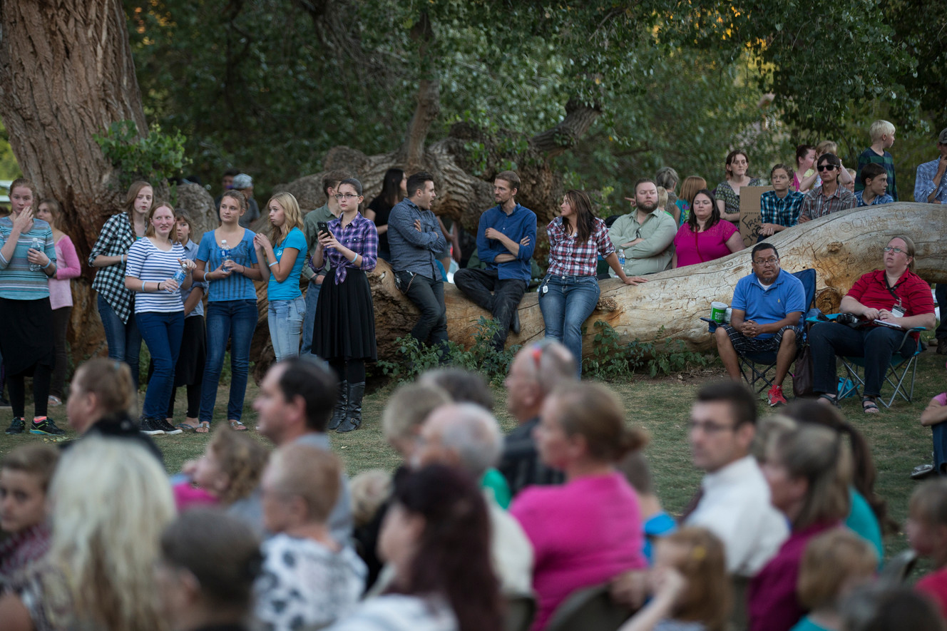People gather for a memorial ceremony at Cottonwood Park in Colorado City, Arizona, on Wednesday, Sept. 14, 2016. The ceremony was held in remembrance of those killed in a flood one year ago. (Photo: Spenser Heaps, Deseret News)
