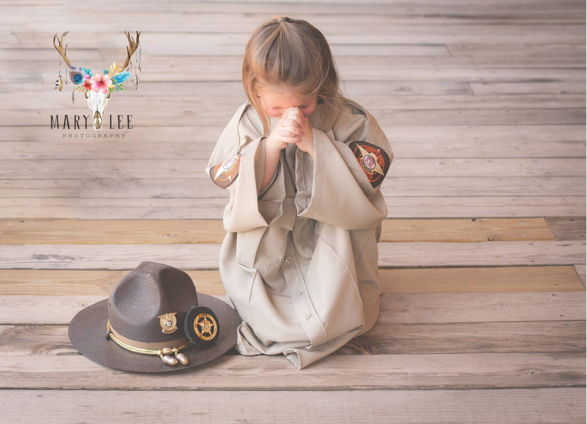 Toddler poses in late father’s deputy uniform, photos go viral