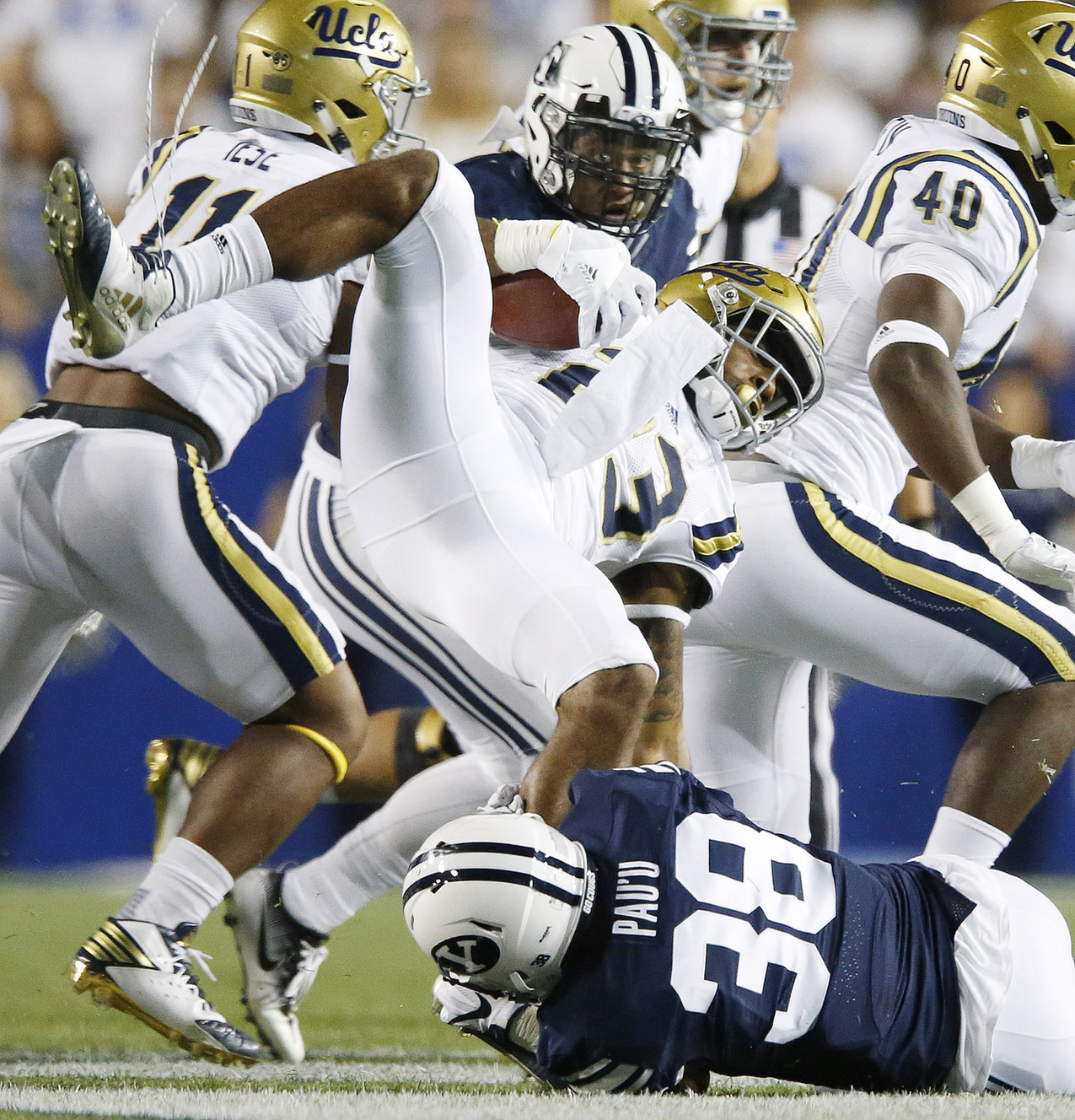 BYU linebacker Butch Pau'u (38) tackles UCLA running back Nate Starks (23) for a loss in Provo on Saturday, Sept. 17, 2016. (Photo: Jeffrey D. Allred, Deseret News)