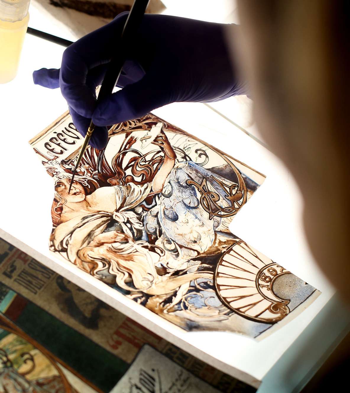 Artists paint the details for the stained glass project called “Roots of Knowledge” at Holdman Studios at Thanksgiving Point in Lehi on Friday, Sept. 16, 2016. The 80-panel stained-glass project will be installed at the Utah Valley University Library and unveiled to the public on Nov. 18 as a capstone to the university's 75th anniversary celebration. (Photo: Laura Seitz, Deseret News)