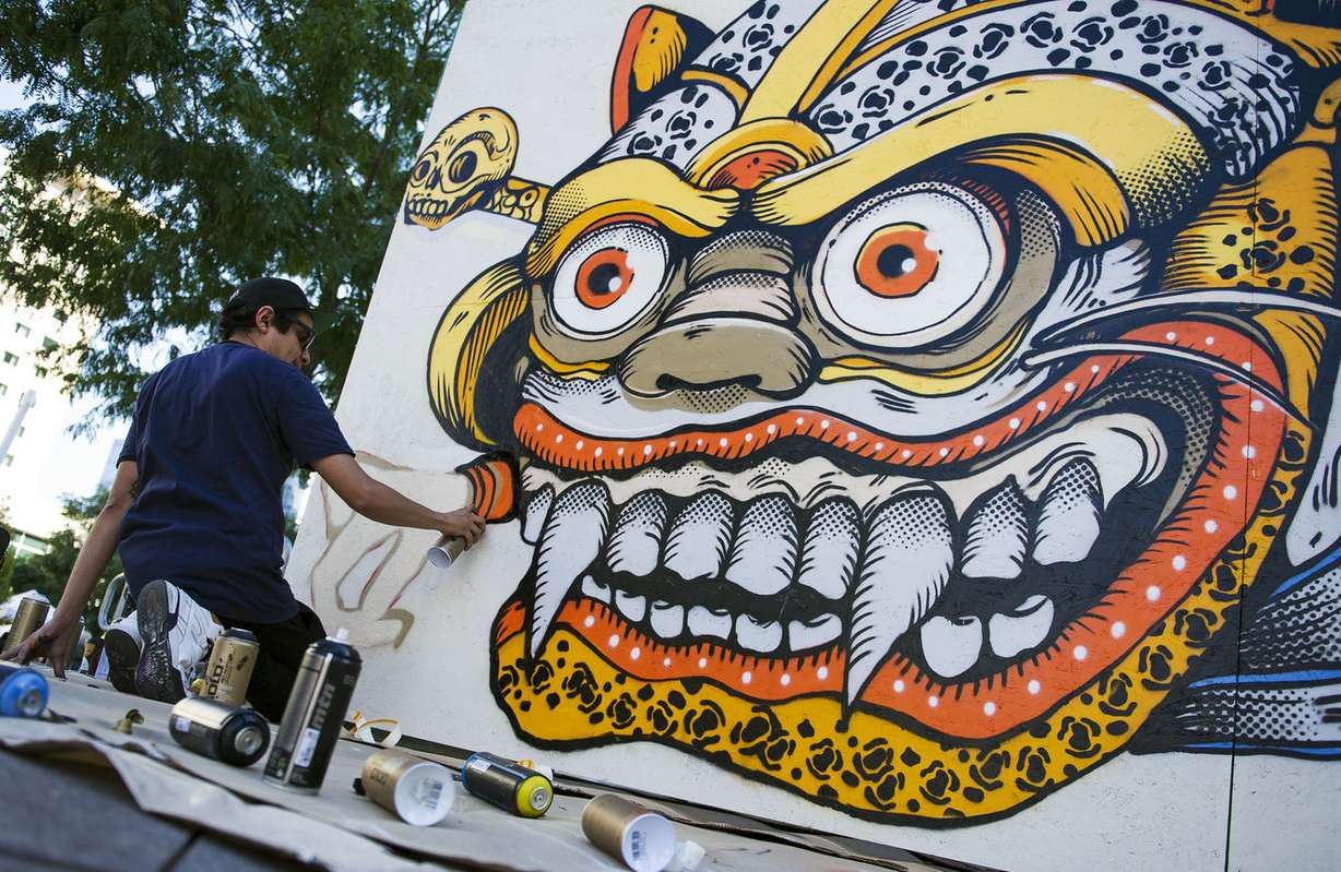 Eduardo Bastida Guzman, of Mexico City, works on his street art project during the Salt Lake City Urban Arts Festival in Salt Lake City on Sunday, Sept. 18, 2016. Bastida said the project took him about six hours to complete. (Photo: Nick Wagner, Deseret News)