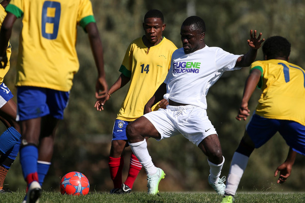 The Eagle Stars, in yellow, and Lone Stars, in white, face off in a semifinal game of the Utah Refugee Soccer Tournament in Salt Lake City on Saturday, Sept. 17, 2016. (Photo: Spenser Heaps, Deseret News)