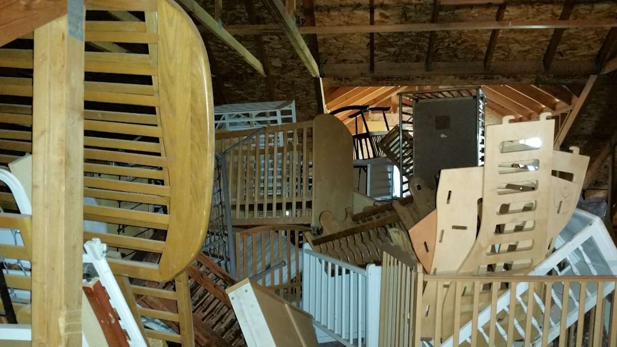 A nearby home is packed from the basement to the rafters with baby cribs — some neatly packed away, others stacked in disarray. (Photo: KSL TV)