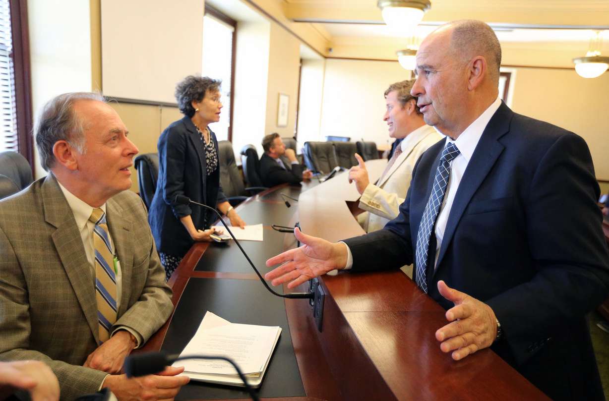 Rep. Earl Tanner, R-West Jordan, and Paul Boyden, executive director of the Statewide Association of Prosecutors, discuss a proposed amendment to Rule 417, Utah Rules of Evidence, regarding a sentencing enhancement for defendants who target their victim with the intent of terrorizing a community, at the Capitol in Salt Lake City on Wednesday, Sept. 21, 2016. (Photo: Kristin Murphy, Deseret News)
