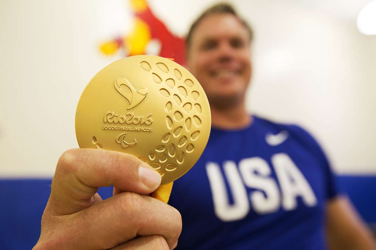 David Blair poses for a photo with his gold medal in Eagle Mountain, Monday, Sept. 19, 2016.