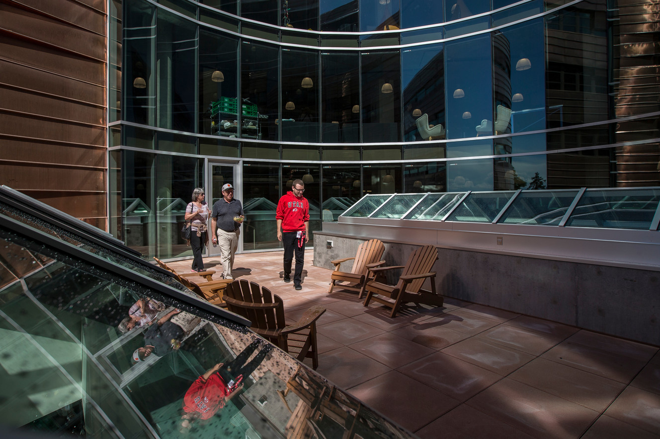 University of Utah graduate student Aaron Dessin, right, who lives in the new Lassonde Studios, shows his parents, Andrea and Marc Dessin, the building during an unveiling ceremony at the University of Utah in Salt Lake City on Thursday, Sept. 22, 2016. (Photo: Spenser Heaps, Deseret News)