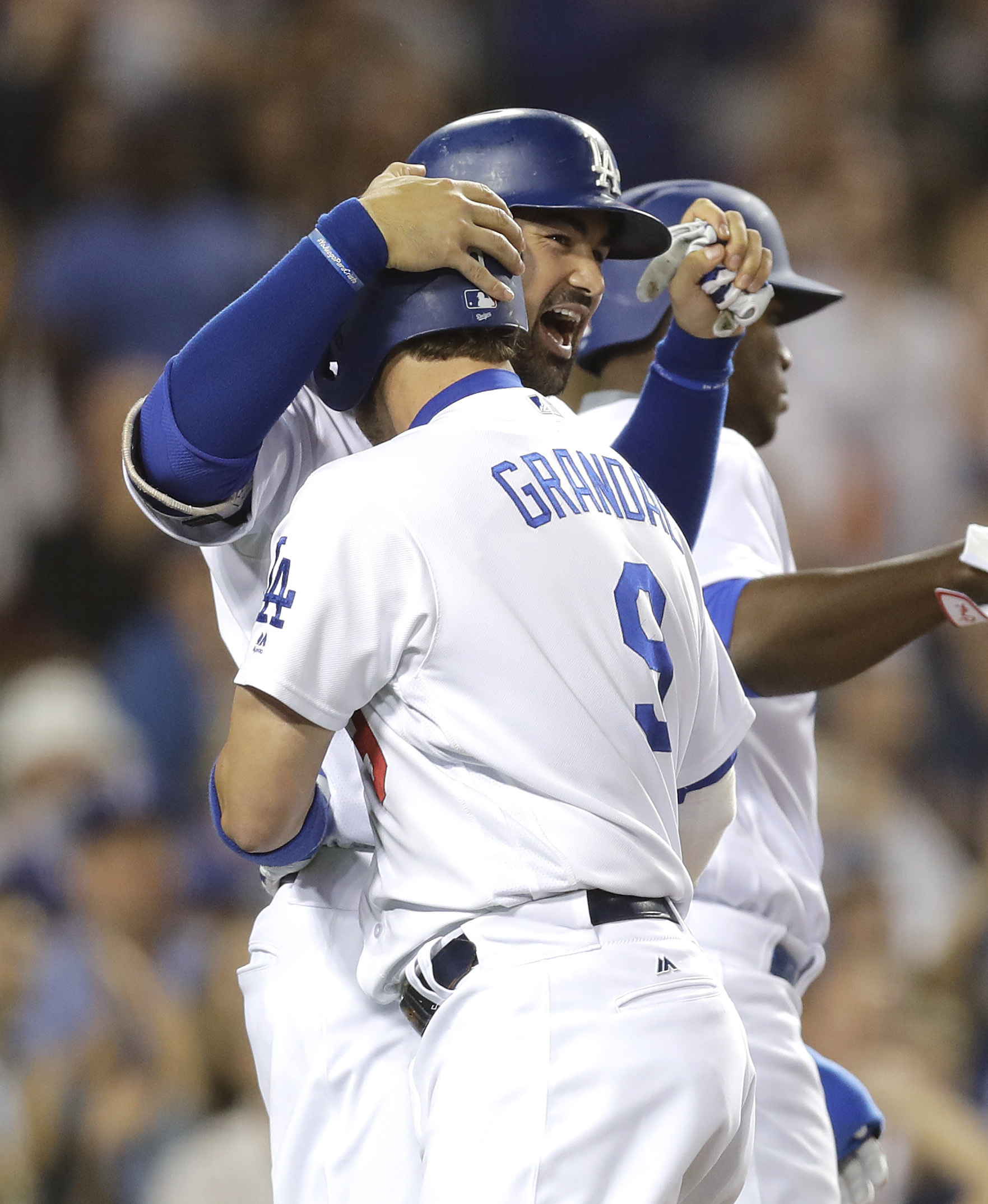 Grandal's grand slam rallies Dodgers past Rockies 7-4