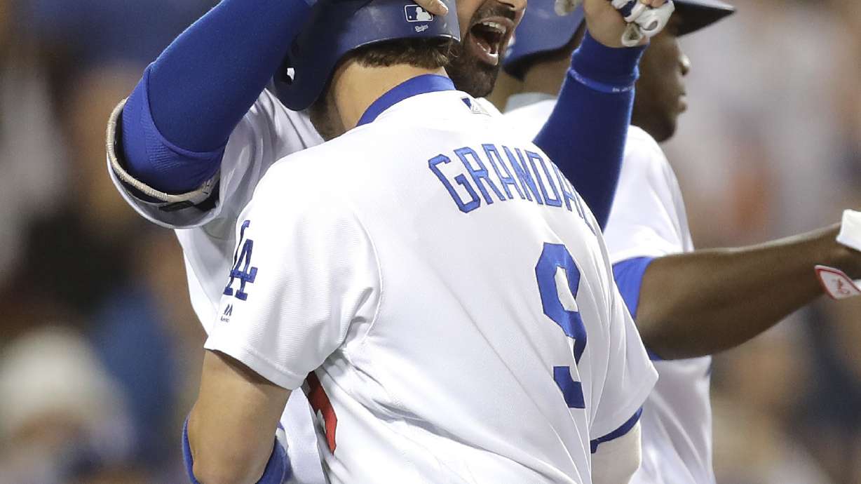 Grandal's grand slam rallies Dodgers past Rockies 7-4