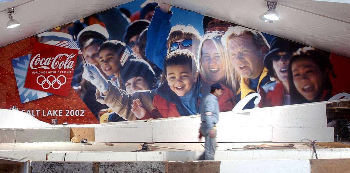 Grey Toy of Commercial Refrigeration based in Edmonton, Alberta works on a 110-foot luge run that will be set up for the public to test out in the Coco Cola "On The Ice" 20,000-square foot attraction set up for the Olympics near the Delta Center Thursday, January 24, 2002. (Photo by Jason Olson, Deseret News, File