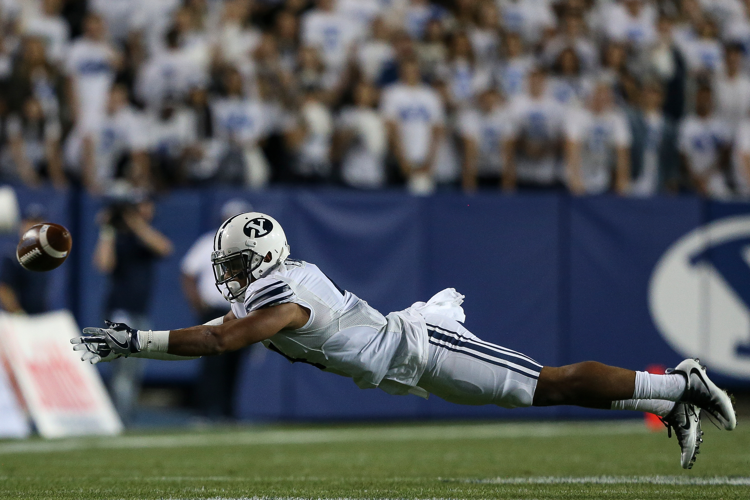BYU linebacker Fred Warner falls short of potential interception during a game at LaVell Edwards Stadium in Provo on Friday, Sept. 30, 2016. (Photo: Spenser Heaps, Deseret News)