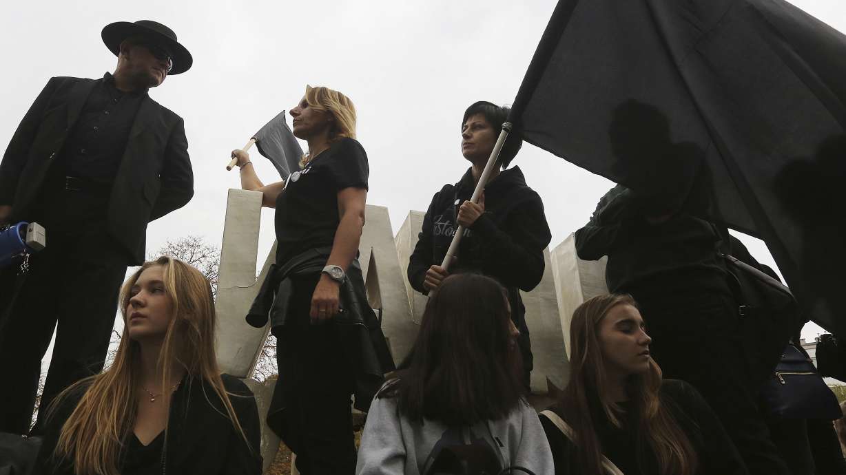 Black-clad Poles protest proposal to completely ban abortion