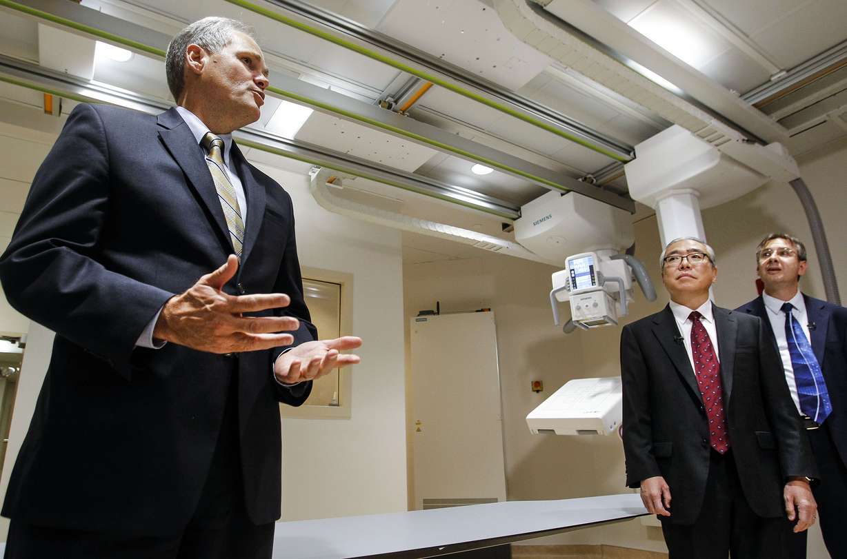 FILE - Quinn McKenna, chief operating officer of University of Utah Health Care, left, welcomes attendees as the unveiling of the new Multitom Rax Twin Robotic X-Ray System at the University Hospital's radiology department in Salt Lake City on Friday, July 15, 2016. (Photo: Weston Kenney, Deseret News, File)
