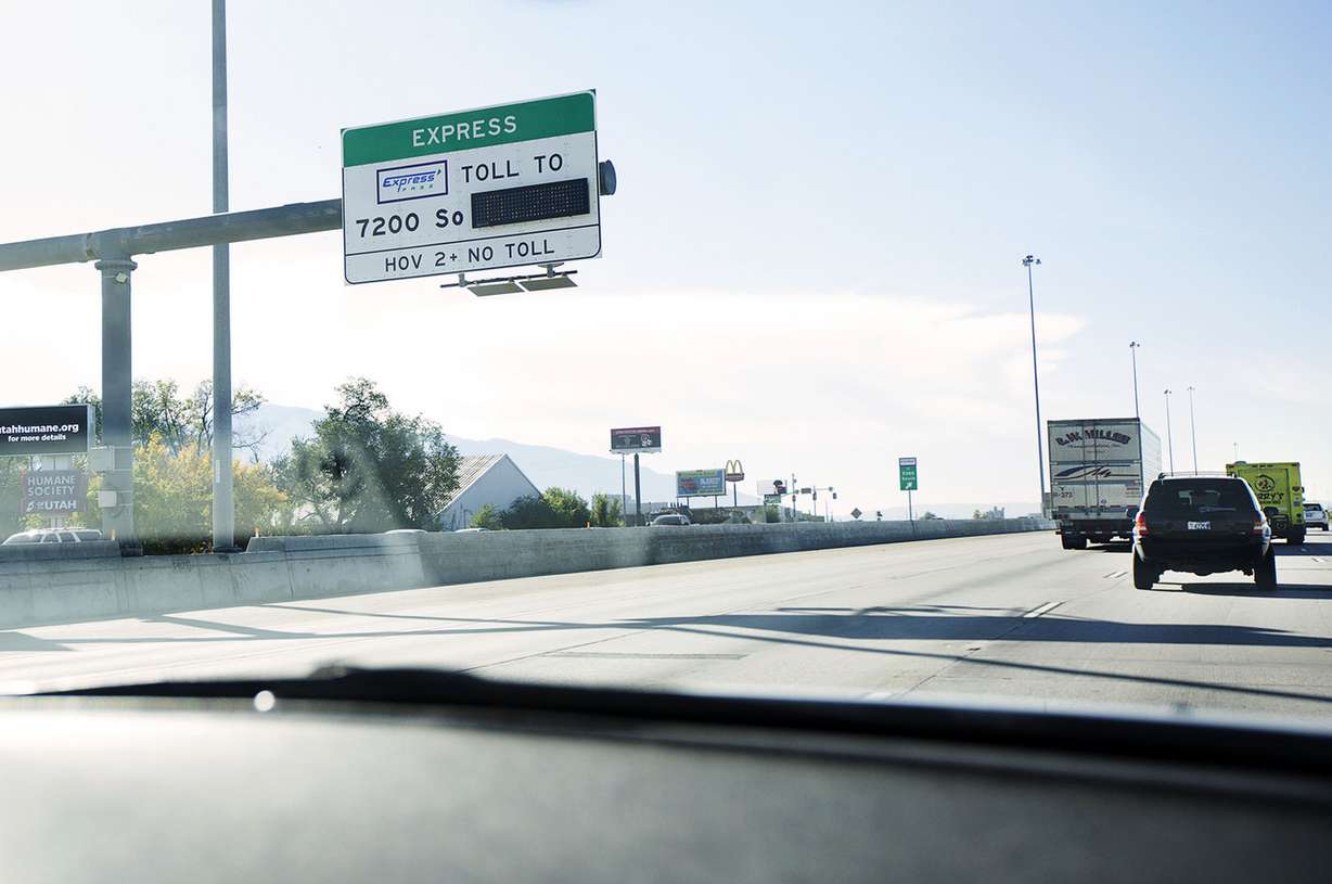 An express lane sign is seen from a Utah Highway Patrol car on southbound I-15 in Murray, Thursday, Oct. 6, 2016. The Utah Highway Patrol and UDOT are trying to educate drivers about the laws governing the lanes. (Photo: Hans Koepsell, Deseret News)