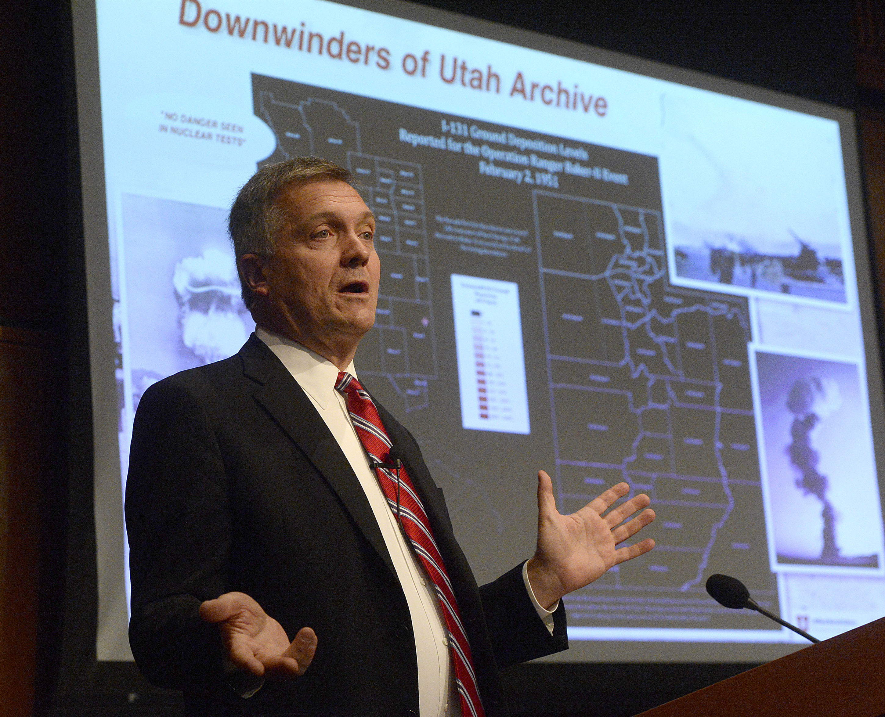 In this Monday, Oct. 3, 2016 photo, former Utah Congressman Jim Matheson, an advocate for compensation for the downwind population in Utah affected by cancer speaks at the launch event for “Downwinders of Utah Archive” at the J. Willard Marriott Library at the University of Utah in Salt Lake City. (Al Hartmann /The Salt Lake Tribune via AP)