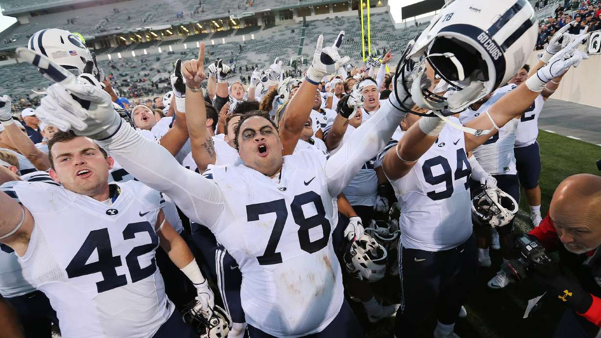 Brigham Young Cougars offensive lineman Tuni Kanuch (78) cheers with teammates after beating the Michigan State Spartans in East Lansing, MI on Saturday, Oct. 8, 2016. BYU won 31-14.