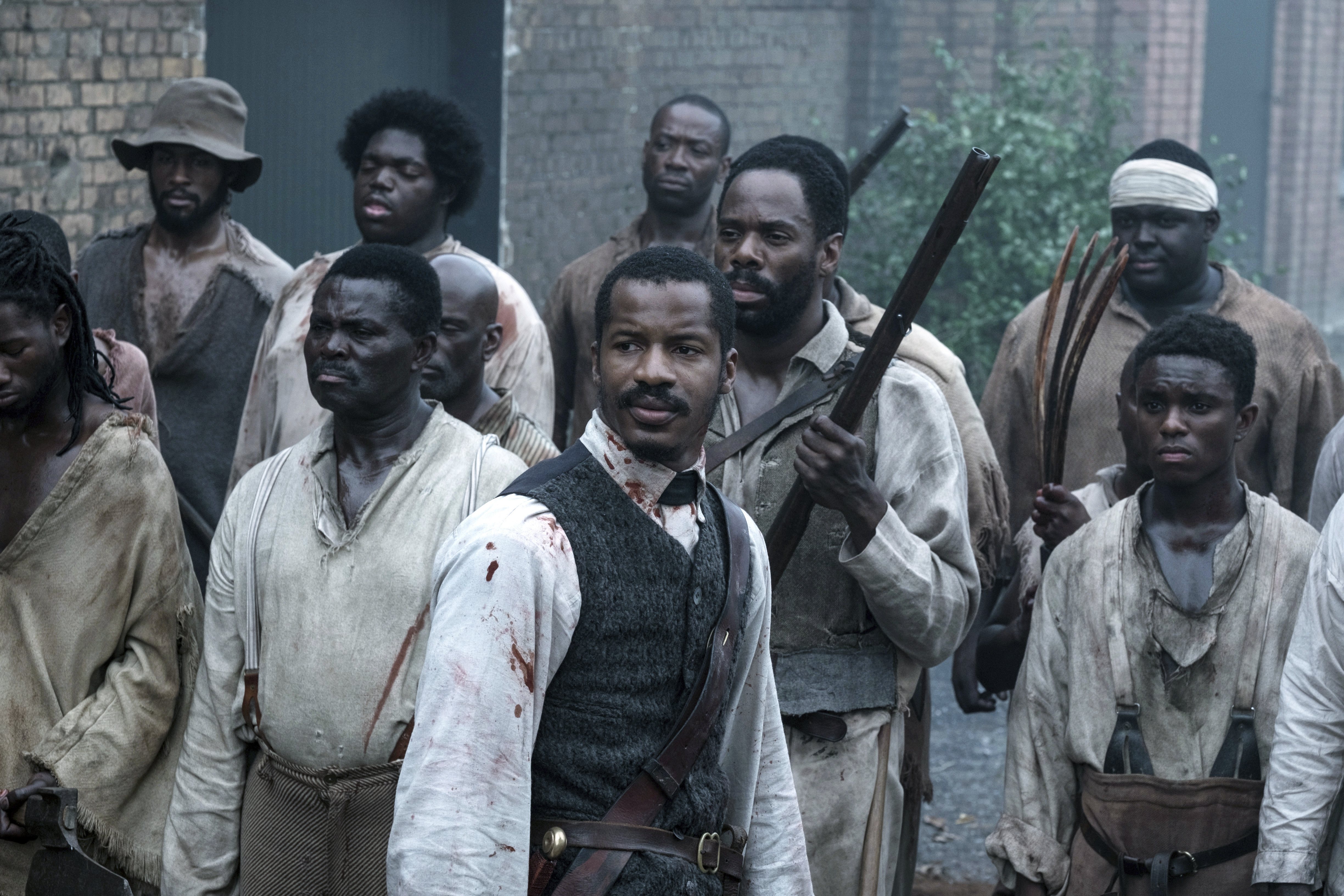 In this file image released by Fox Searchlight Films shows Nate Parker as Nat Turner, center, in a scene from "The Birth of a Nation." Nate Parker’s Nat Turner biopic “The Birth of a Nation,” opened with a disappointing $7.1 million, according to studio estimates Sunday, Oct. 9, 2016. (Jahi Chikwendiu/Fox Searchlight via AP, File)