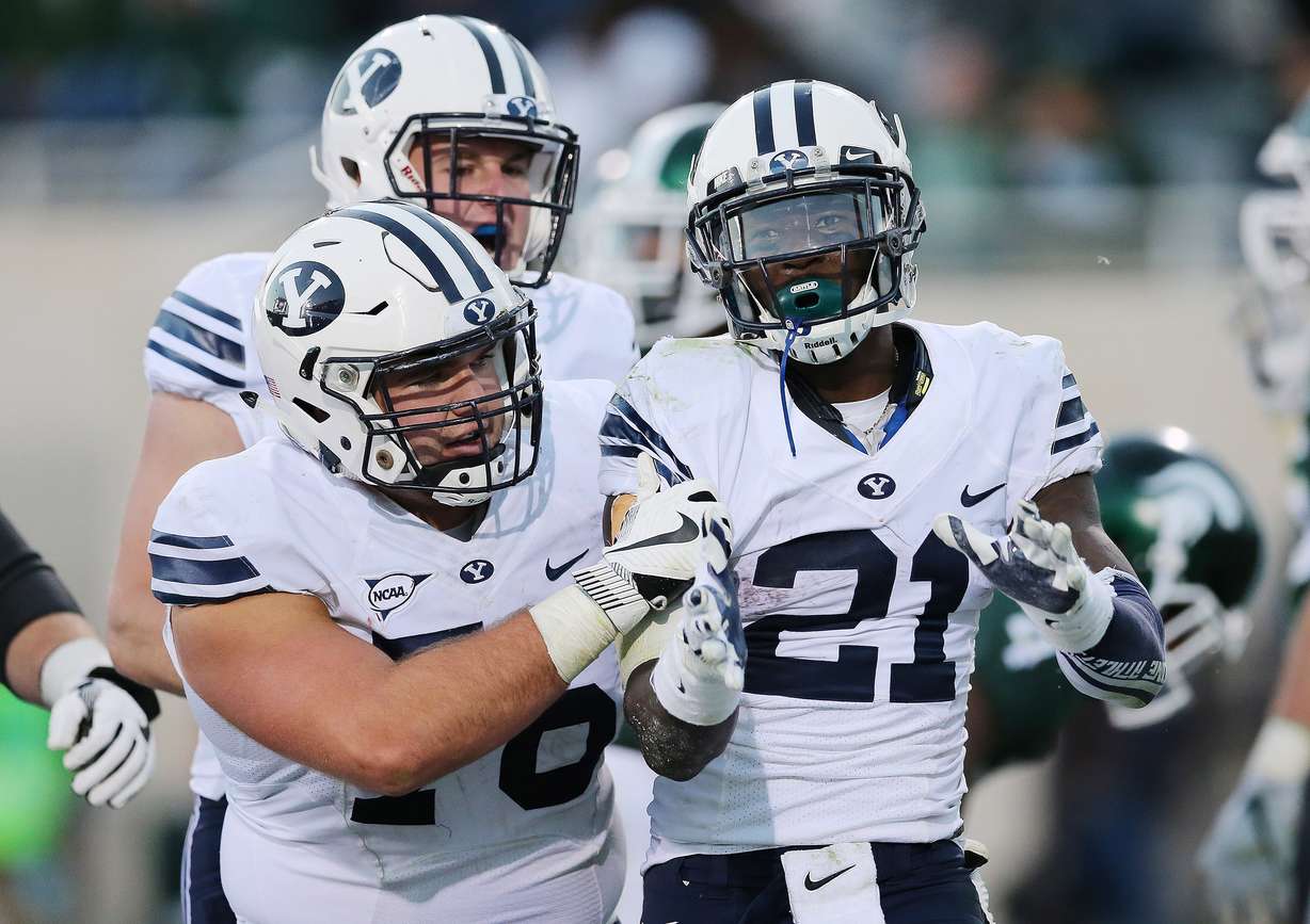 Brigham Young Cougars running back Jamaal Williams (21) celebrates his touchdown against the Michigan State Spartans on Saturday, Oct. 8, 2016. BYU won 31-14. in East Lansing, Michigan. (Photo: Jeffrey D. Allred, Deseret News)