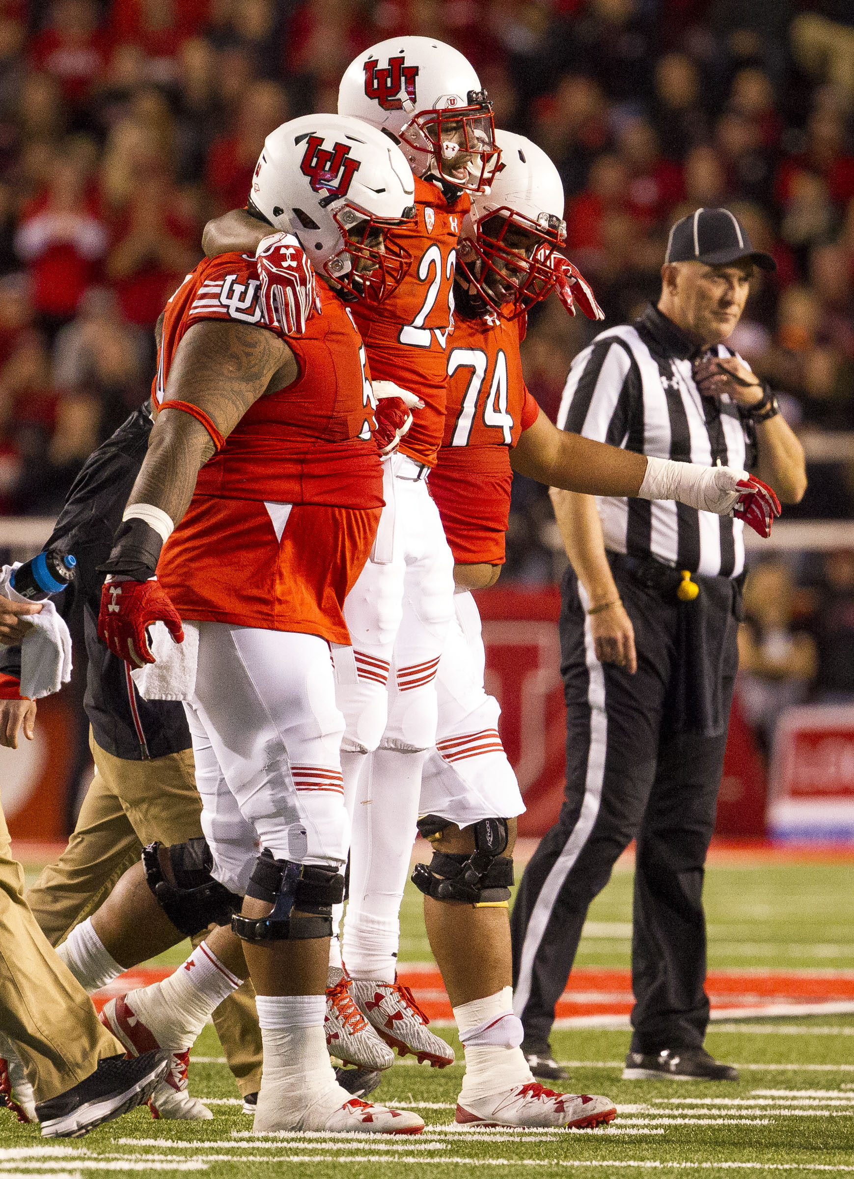 Utah running back Armand Shyne (23) is carried off the field by teammates Salesi Uhatafe (74) and Isaac Asiata (54) during the second half of an NCAA college football game against Arizona in Salt Lake City on Sunday, Oct. 8, 2016. Utah battled back from a first-half deficit to defeat Arizona 36-23.(Photo: Nick Wagner, Deseret News)
