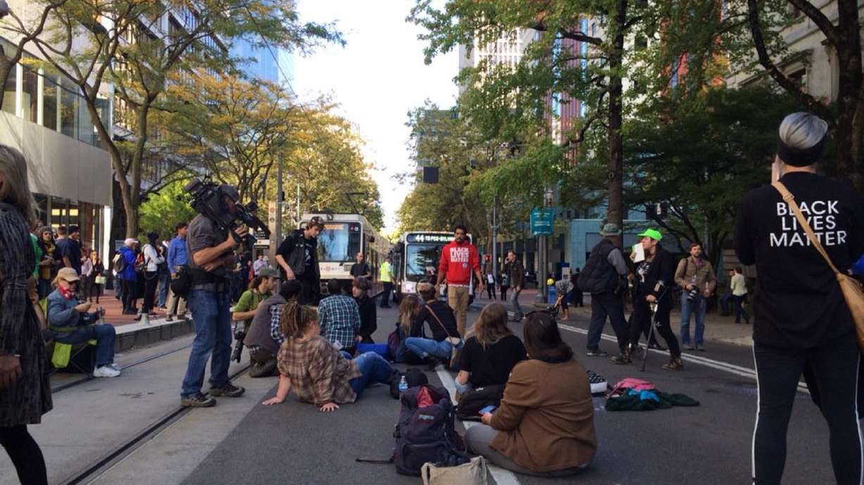 Activists clash with Portland police as council OKs contract