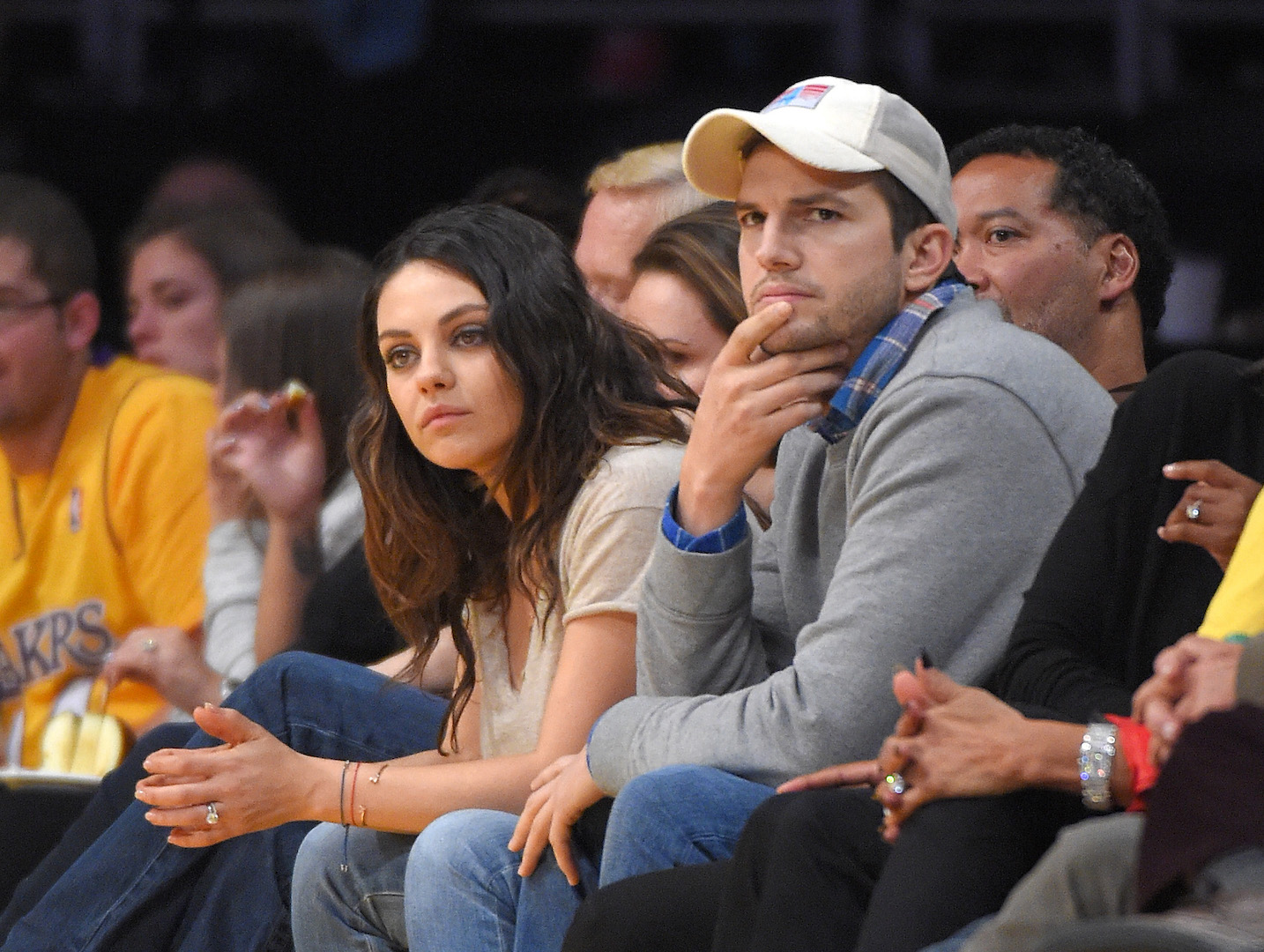 Actors Mila Kunis, left, and Ashton Kutcher watch the Los Angeles Lakers play the Oklahoma City Thunder in an NBA basketball game, Friday, Dec. 19, 2014, in Los Angeles. (Mark J. Terrill, AP Photo, file)