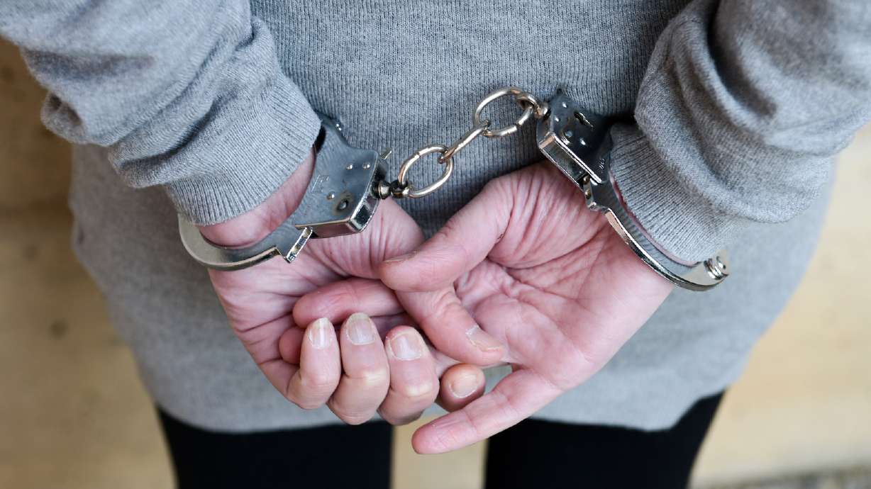 A southern Utah woman is accused of hitting her daughter with a belt, rubbing hot spices on her face and cutting her hair as 'punishment' for getting in trouble at school.