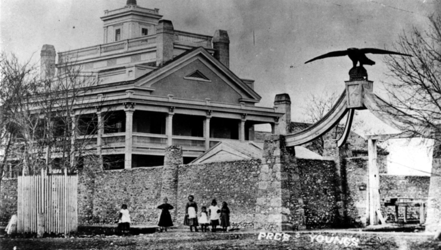 Eagle Gate and Beehive House in 1874 (Photo Credit: Utah State Historical Society)