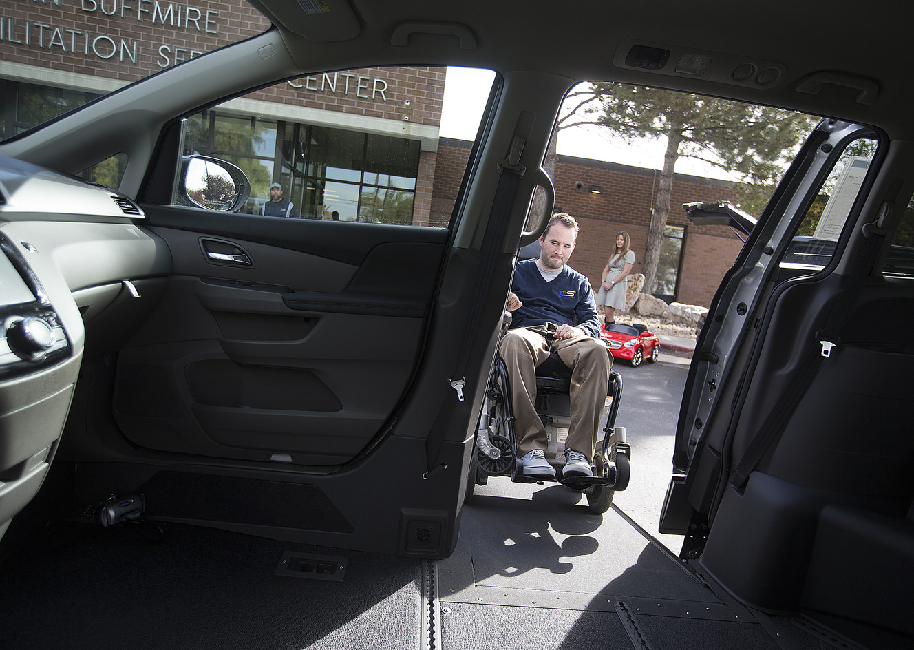 Dustin Godnick enters a minivan that has been adapted for wheelchair accessibility at the Utah Center for Assistive Technology's open house in Salt Lake City on Thursday, Oct. 13, 2016. (Photo: Laura Seitz, Deseret News)