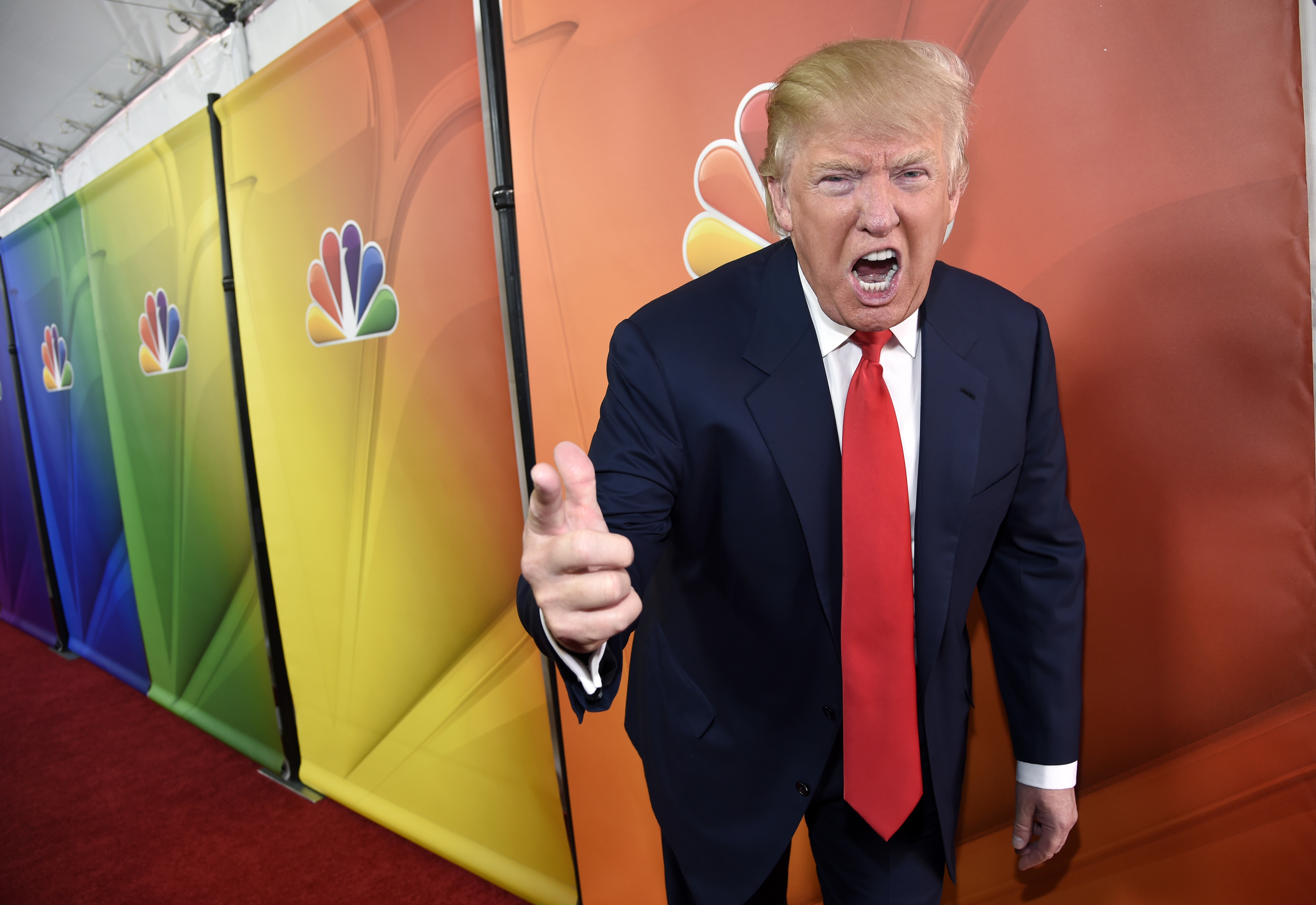 FILE - In this Jan. 16, 2015 file photo, Donald Trump, host of the television series "The Celebrity Apprentice," mugs for photographers at the NBC 2015 Winter TCA Press Tour in Pasadena, Calif. (Photo by Chris Pizzello, Invision via AP, File)