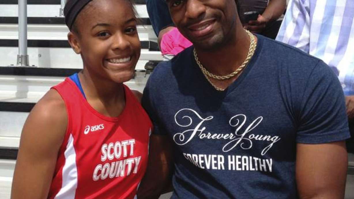 The Latest: Tyson Gay at large vigil after daughter's death