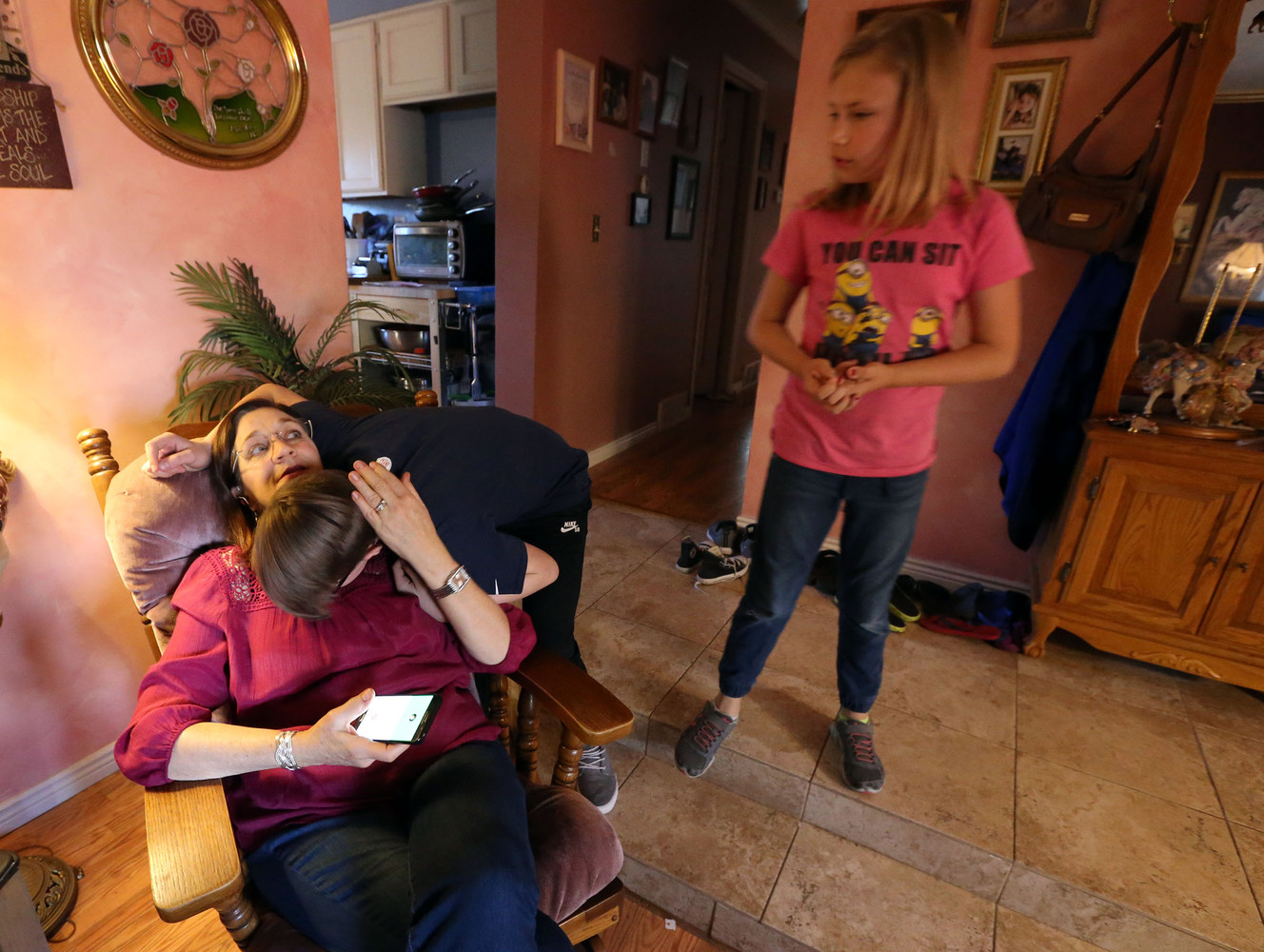 Cindi Rogers gets a hug from grandson Kaiden Kligmann as granddaughter Elliana Kligmann watches at home in Sandy on Monday, Oct. 17, 2016. (Photo: Kristin Murphy, Deseret News)