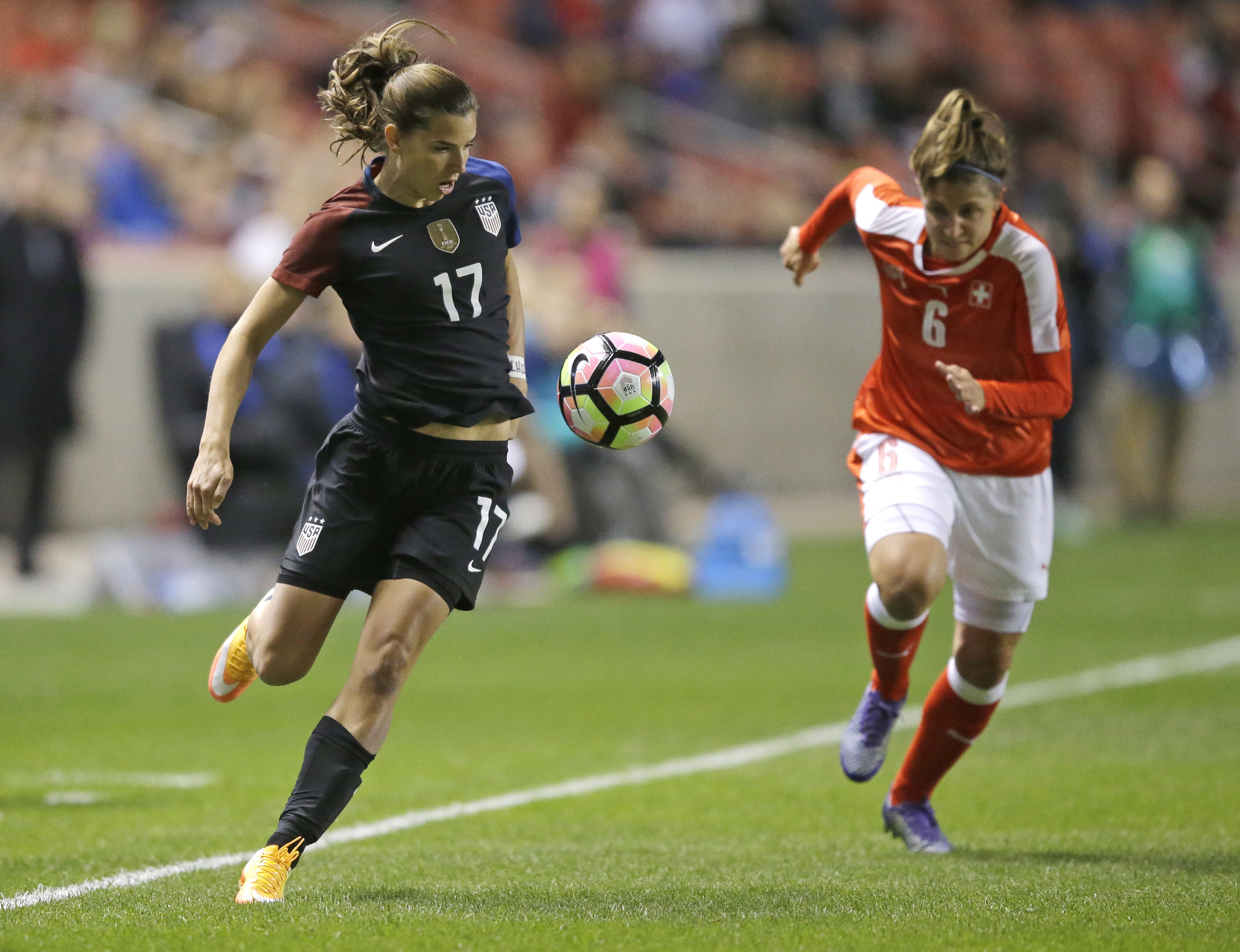 United States' Tobin Heath controls the ball as Switzerland's Selina Kuster (6) closes in during the first half during an international friendly soccer match Wednesday, Oct. 19, 2016, in Sandy, Utah. (AP Photo/Rick Bowmer)