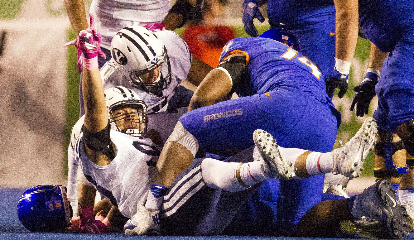 BYU linebacker Trajan Pili (98) points to the sky after sacking Boise State quarterback Brett Rypien (4) during the first half of an NCAA football game between Boise State and Brigham Young in Boise on Thursday, Oct. 20, 2016. (Photo: Nick Wagner, Deseret News)
