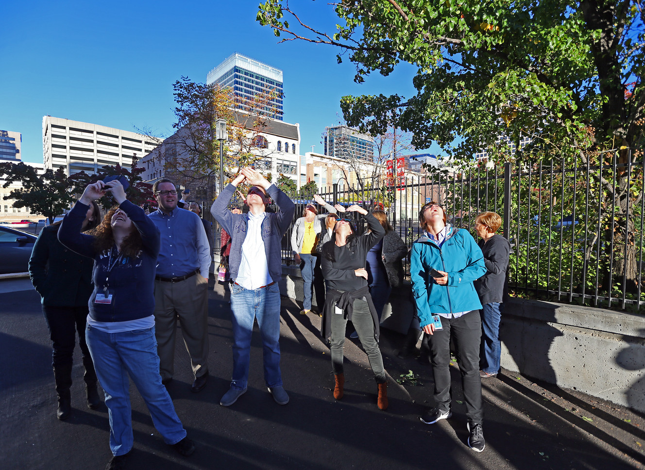 Onlookers watch as Salt Lake County District Attorney Sim Gill, rappels off the Maverik base camp building in Salt Lake City on Friday, Oct. 21, 2016. (Photo: Scott G Winterton, Deseret News)