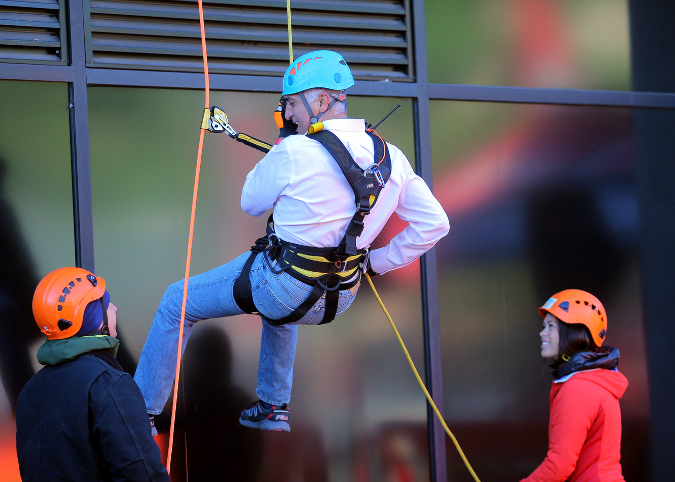 Salt Lake County District Attorney Sim Gill, rappels off the Maverik base camp building in Salt Lake City on Friday, Oct. 21, 2016. (Photo: Scott G Winterton, Deseret News)