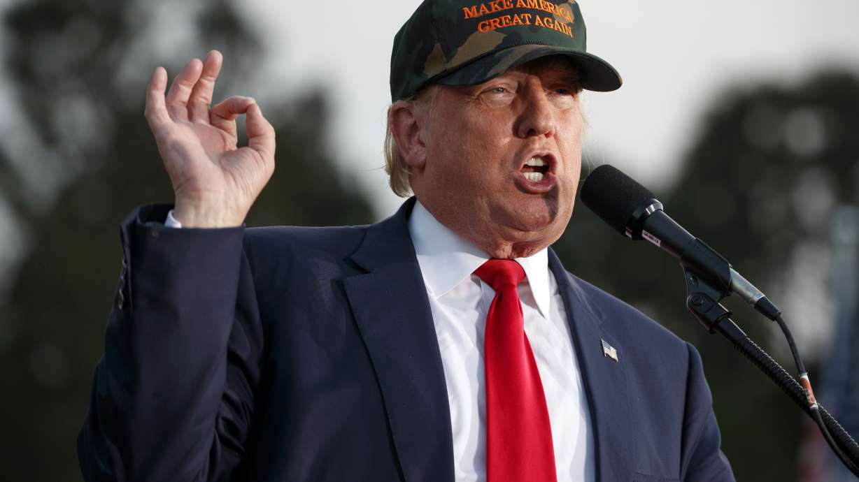 The Latest: Pence scoffs at Clinton's post-election plans